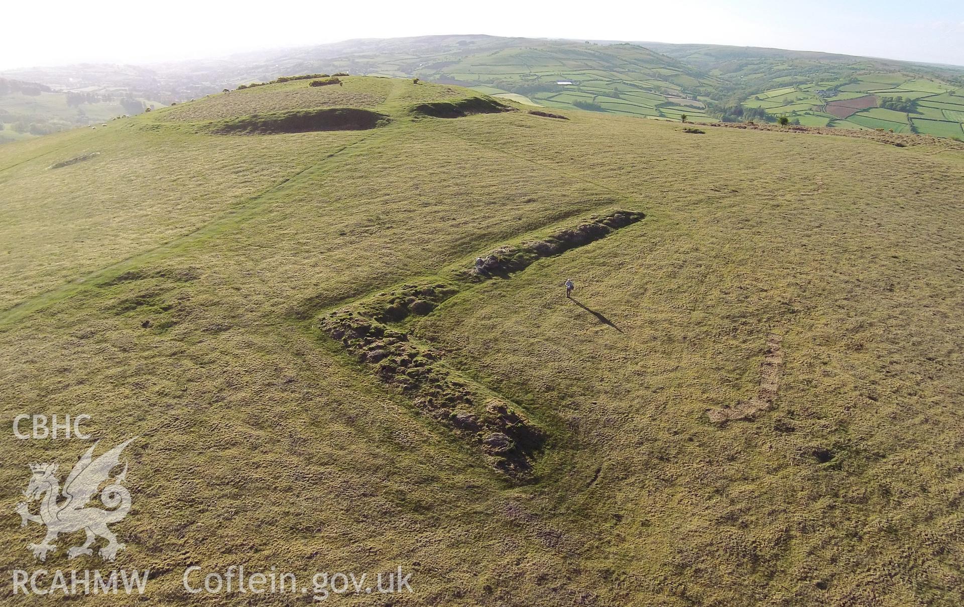 Aerial photograph showing the hillfort and pillow mounds at Twyn y Gaer taken by Paul Davis, 23rd May 2015.