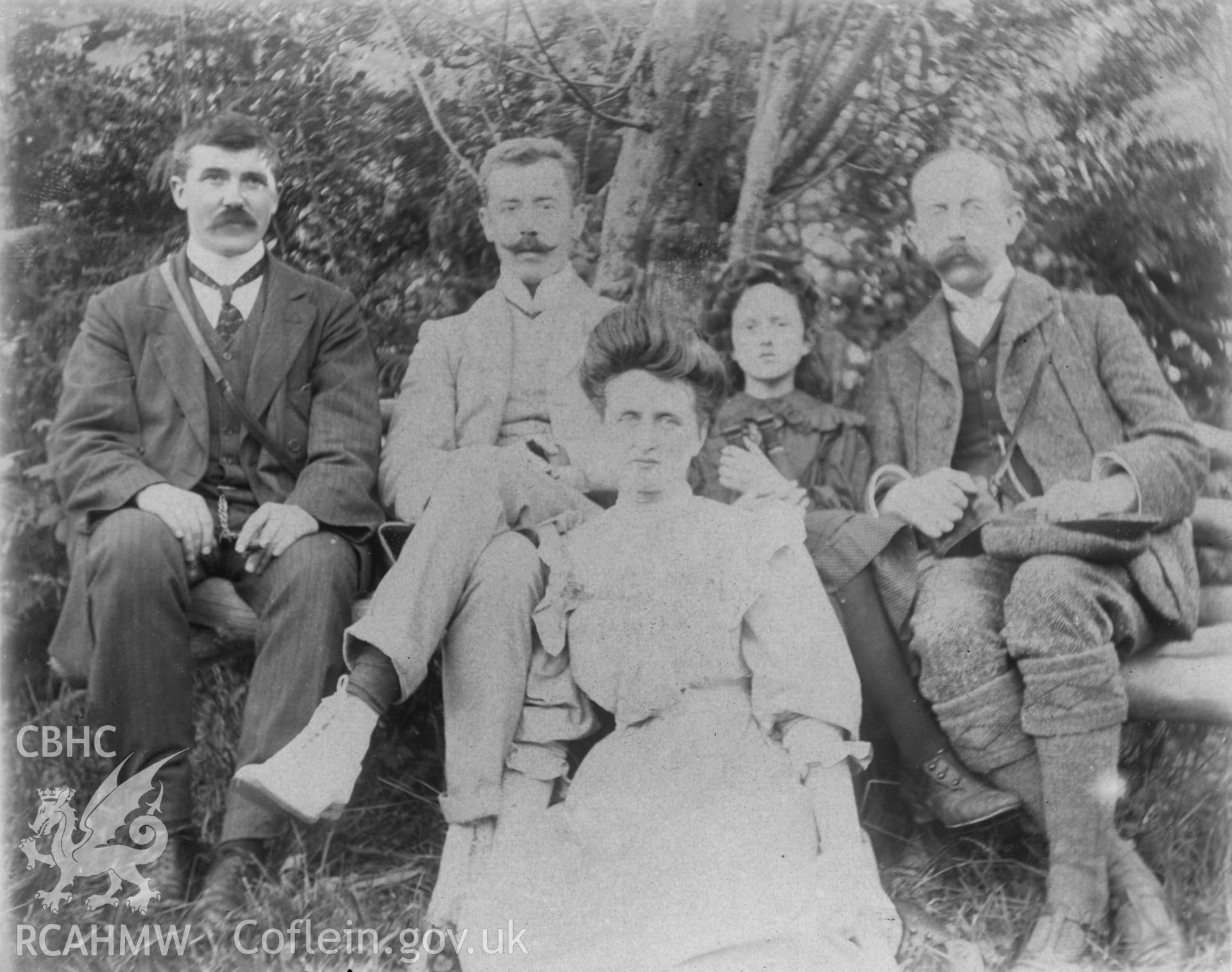 Group portrait taken 'Near Rheidol Falls 1909'. Digitised from a photograph album showing views of Aberystwyth and District, produced by David John Saer, school teacher of Aberystwyth. Loaned for copying by Dr Alan Chamberlain.