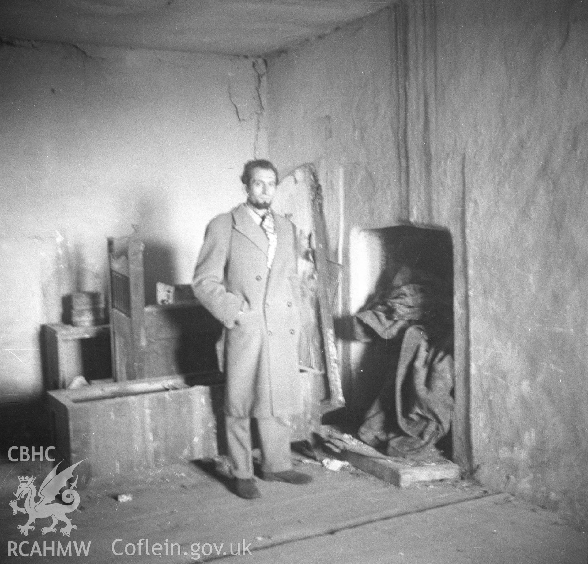 Black and white acetate negative showing interior detail of room (with standing figure) Trimley Hall, Llanfynydd.