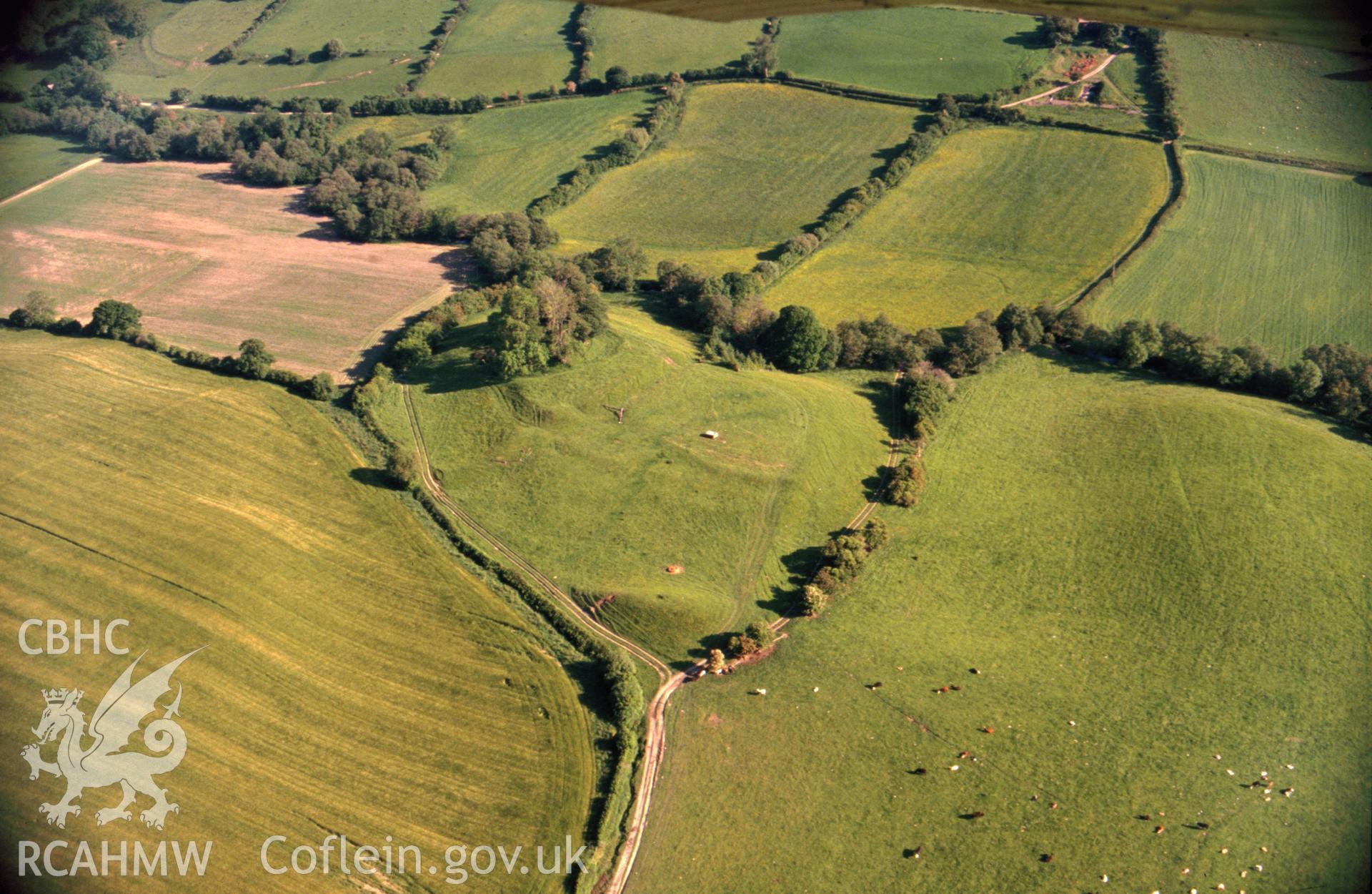 RCAHMW colour slide oblique aerial photograph of Castell Foel-allt, Whitton, taken by CR Musson on 13/06/88