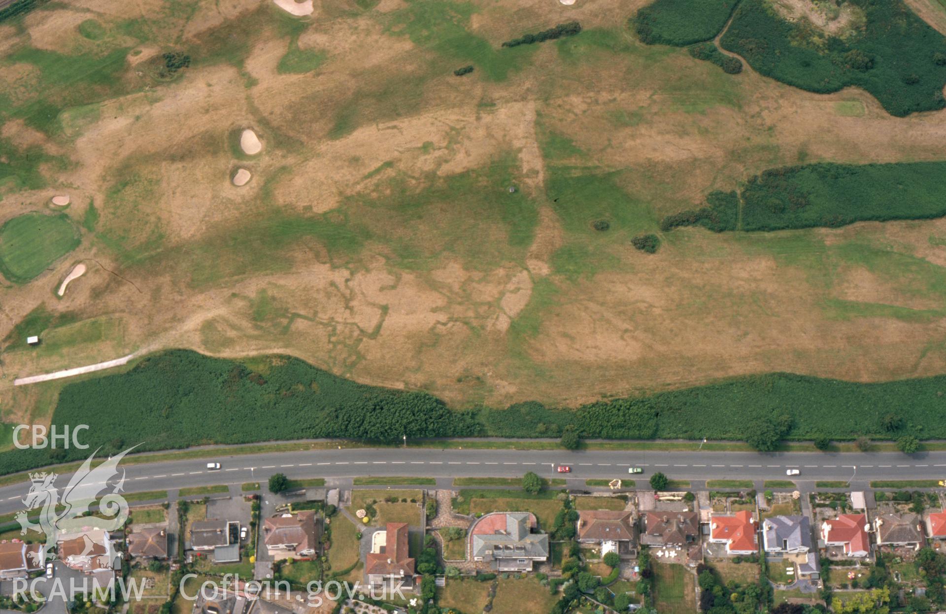 RCAHMW colour slide aerial photograph of Maesdu Golf Course, First World War practice trenches, parchmarks. Taken by Toby Driver on 15/07/2003