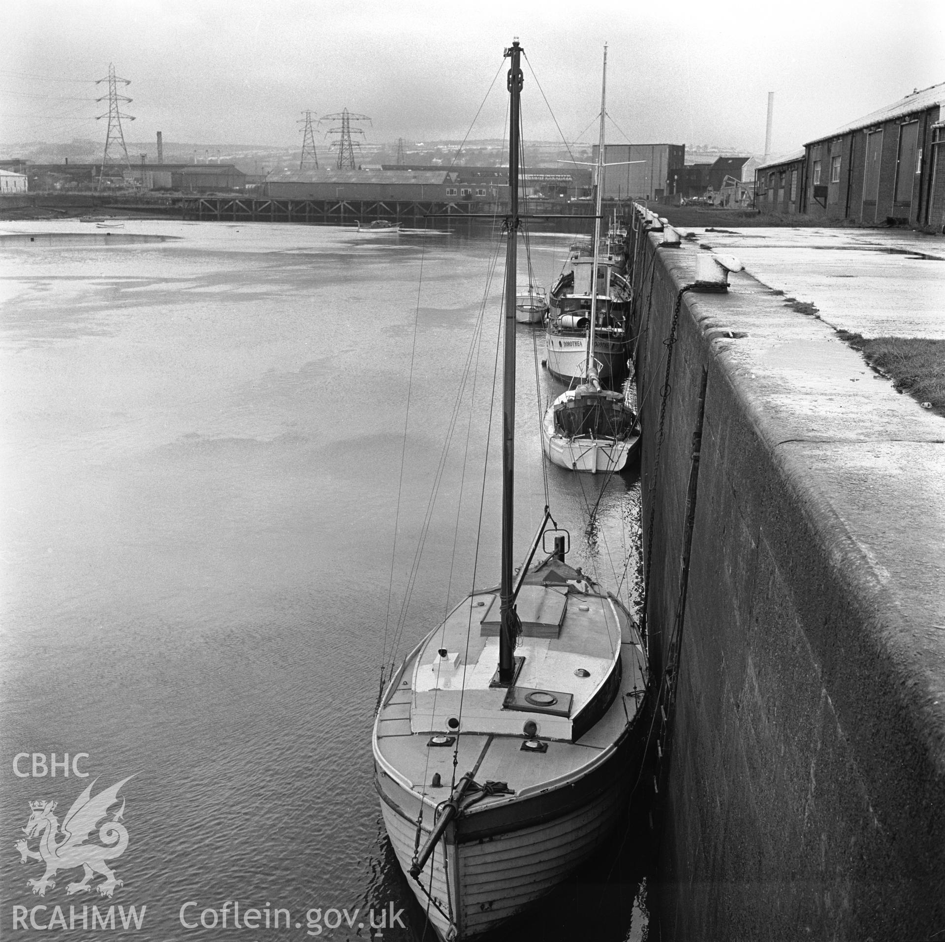 Black and white photograph showing small craft using the North Dock.