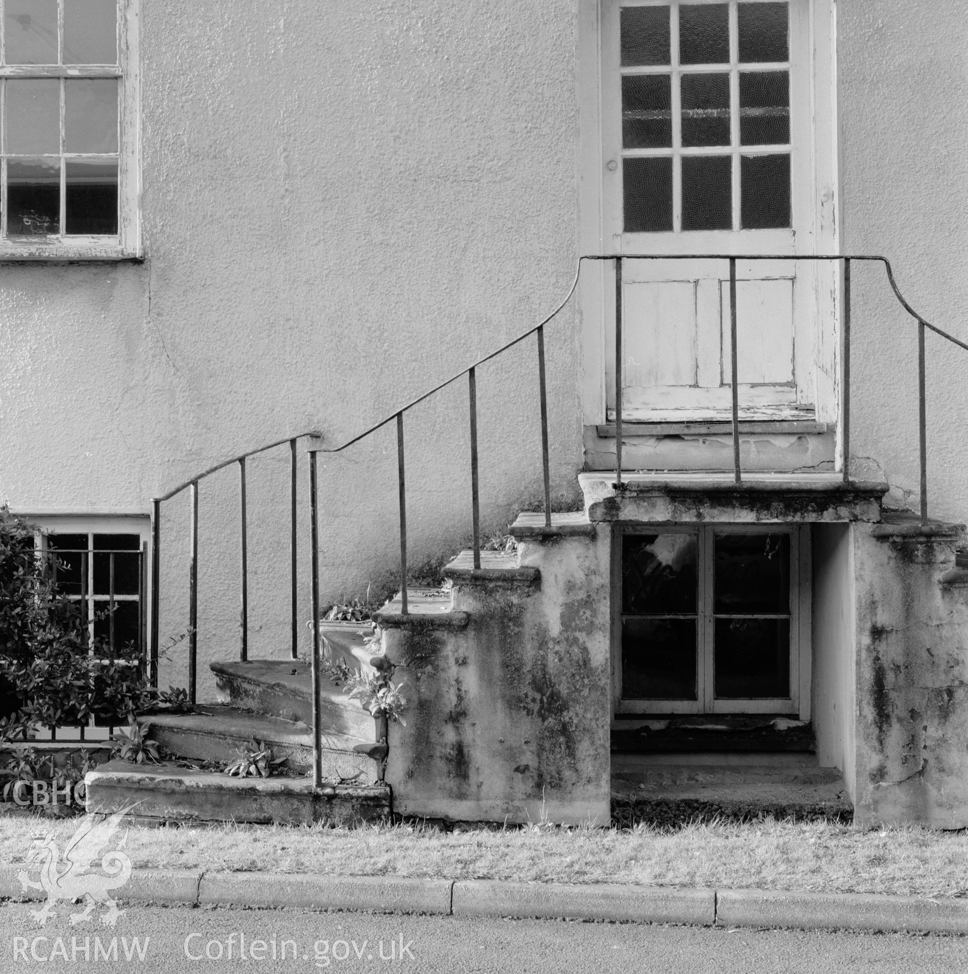 Exterior view showing steps to entrance in main elevation.