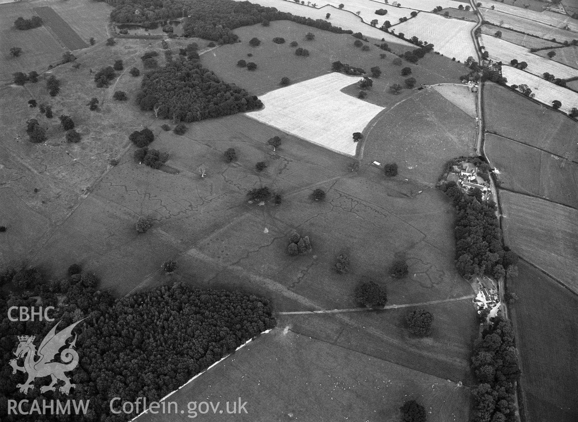 RCAHMW black and white oblique aerial photograph of Bodelwyddan Park Army Practice Trenches, taken by C R Musson, 22/07/1996.