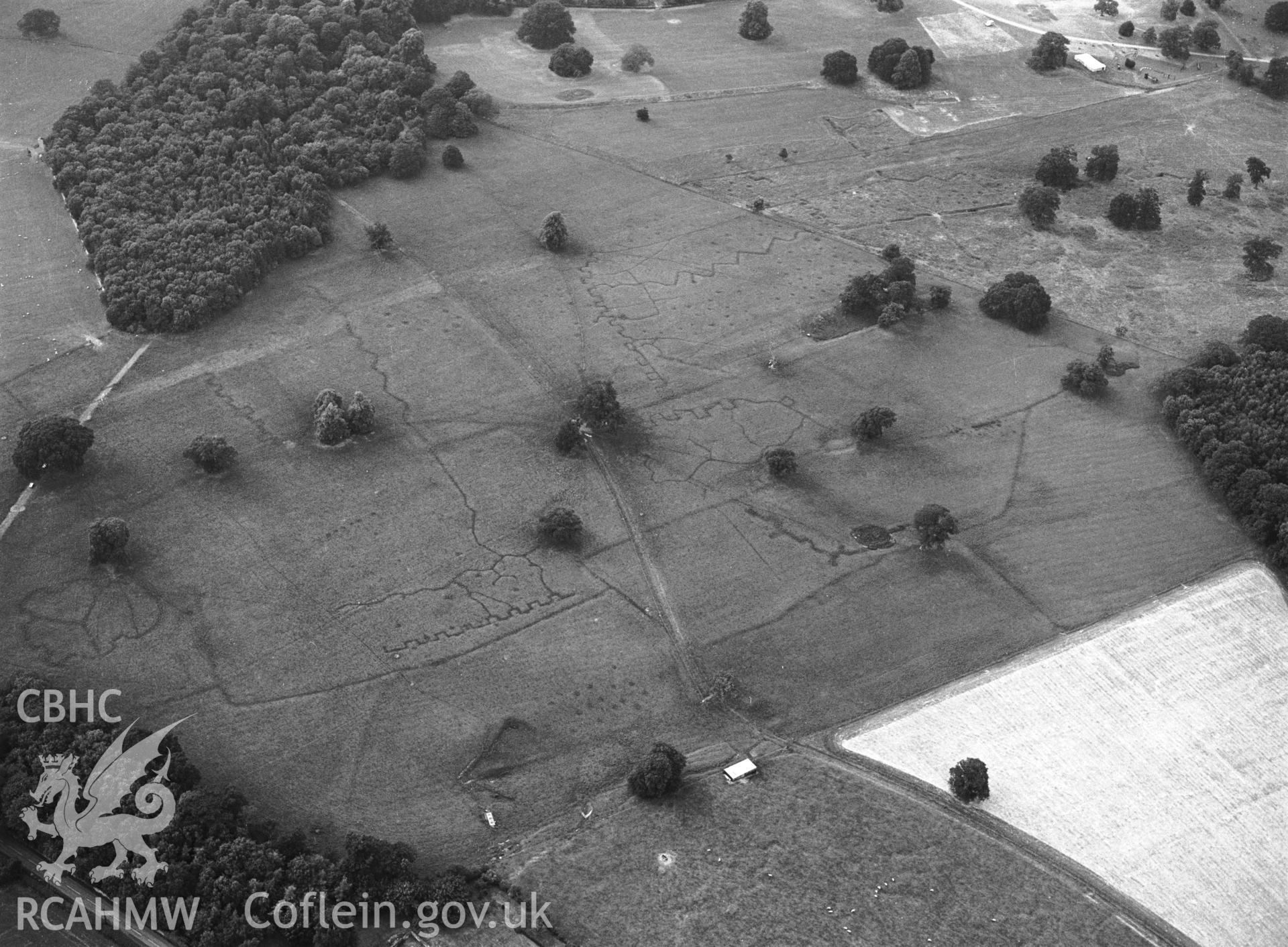 RCAHMW black and white oblique aerial photograph of Bodelwyddan Park Army Practice Trenches, taken by C R Musson, 22/07/1996.