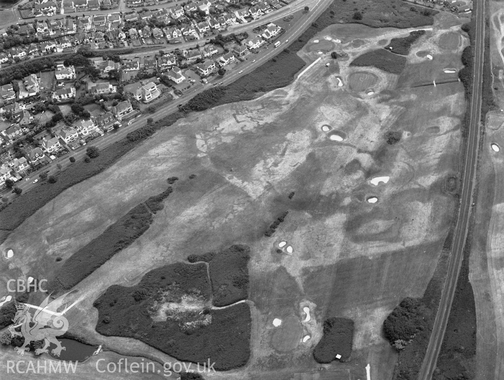 RCAHMW black and white aerial photograph of Maesdu Golf Course, First World War practice trenches, parchmarks. Taken by Toby Driver on 15/07/2003