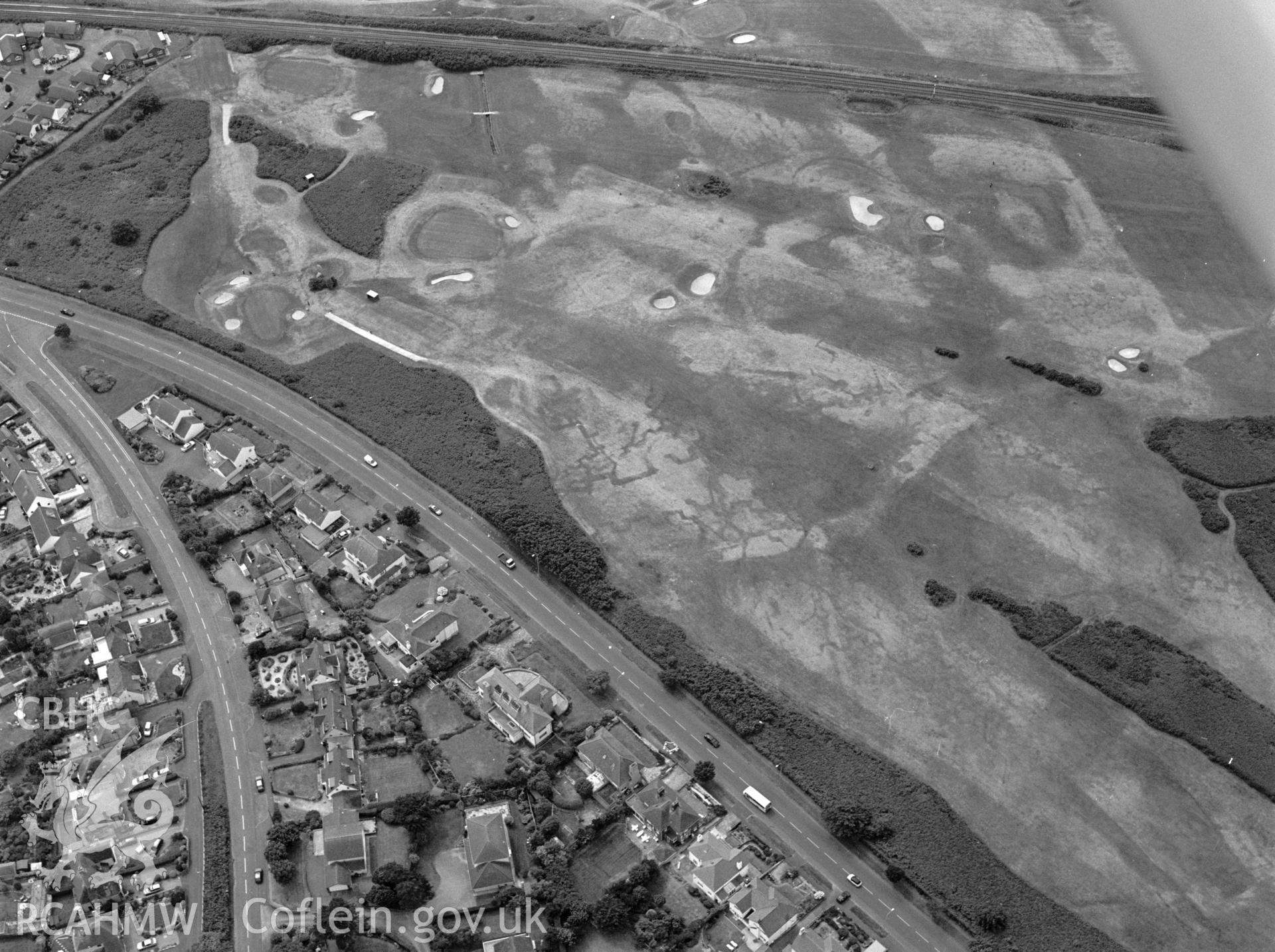 RCAHMW black and white aerial photograph of Maesdu Golf Course, First World War practice trenches, parchmarks. Taken by Toby Driver on 15/07/2003