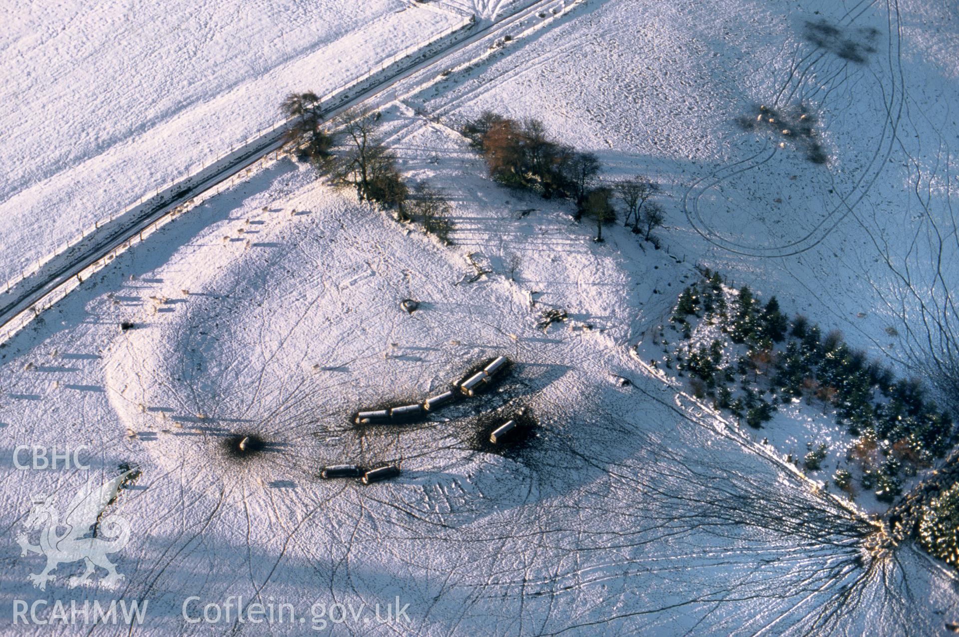 RCAHMW colour slide oblique aerial photograph of Llethrau Camp, Beguildy, taken on 09/01/1999 by CR Musson