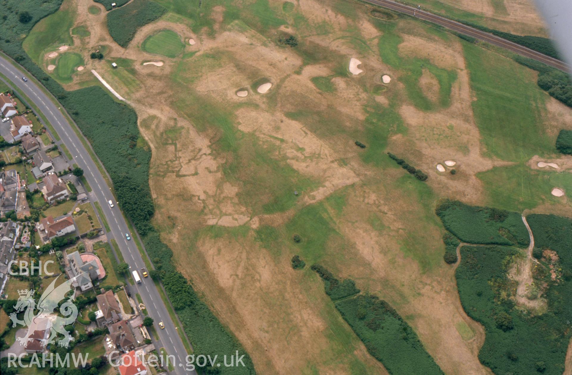 RCAHMW colour slide aerial photograph of Maesdu Golf Course, First World War practice trenches, parchmarks. Taken by Toby Driver on 15/07/2003