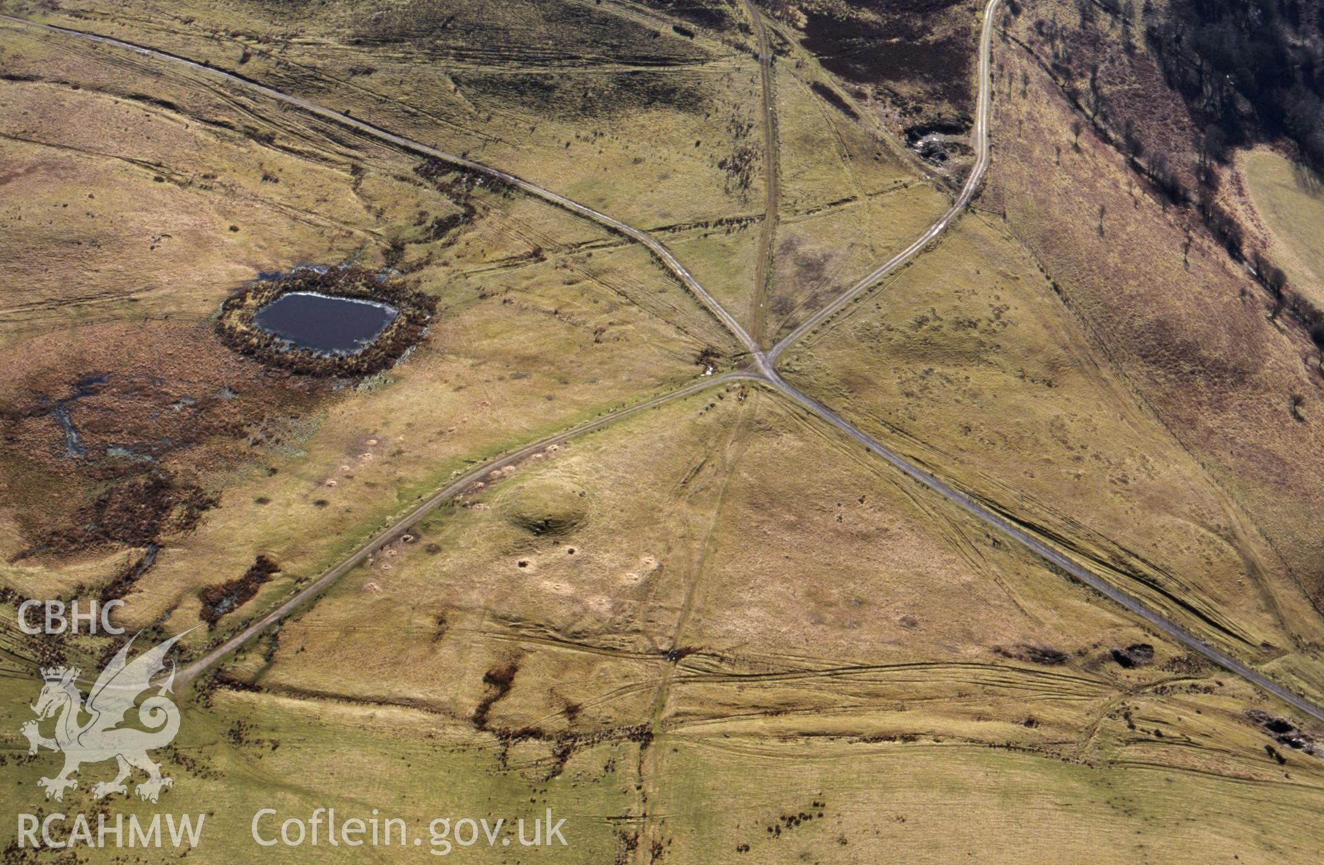 Slide of RCAHMW colour oblique aerial photograph of Bryn y Maen barrow taken by T.G. Driver, 16/2/2001.