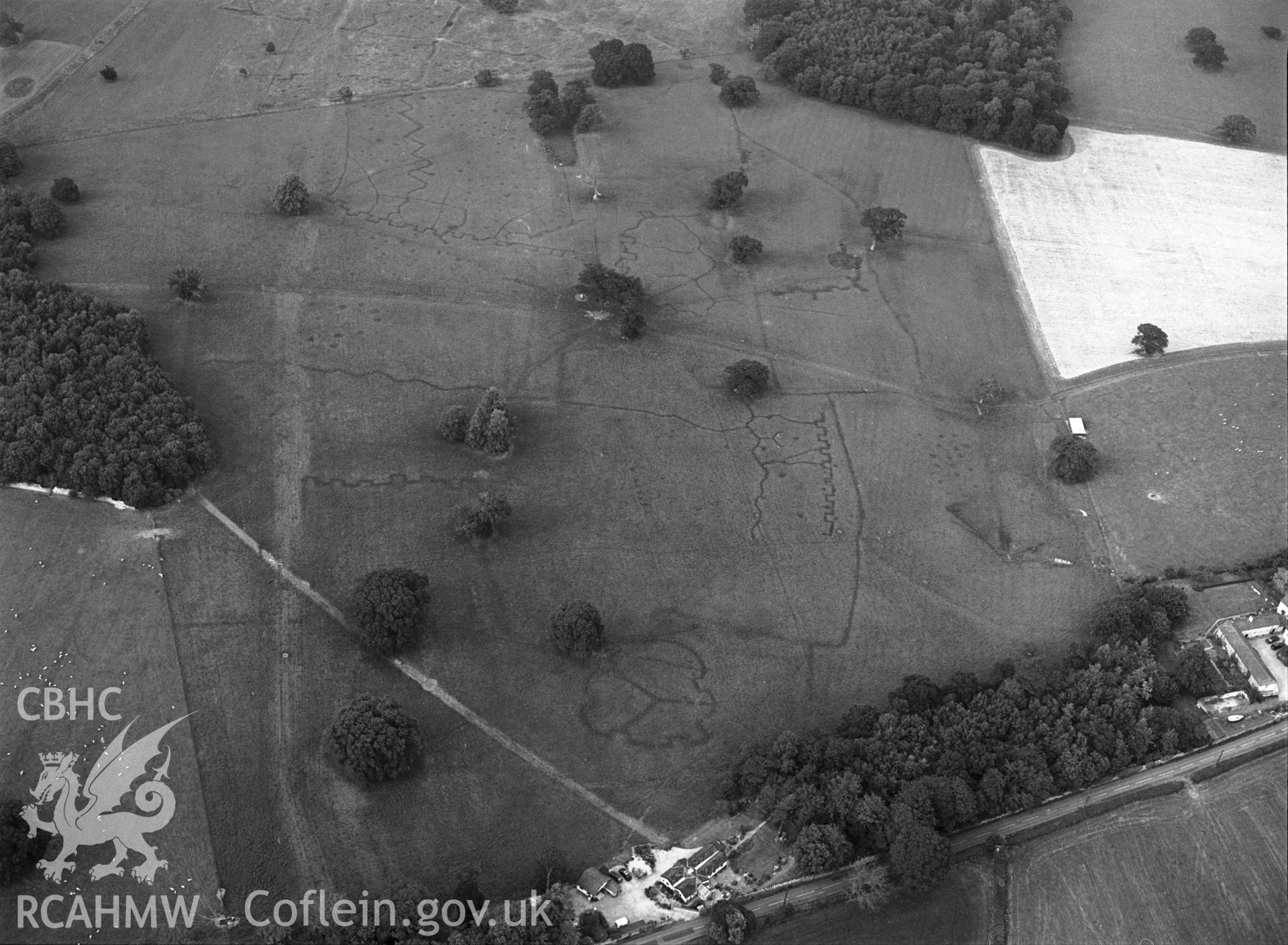 RCAHMW black and white oblique aerial photograph of Bodelwyddan Park Army Practice Trenches, taken by C R Musson, 22/07/1996.