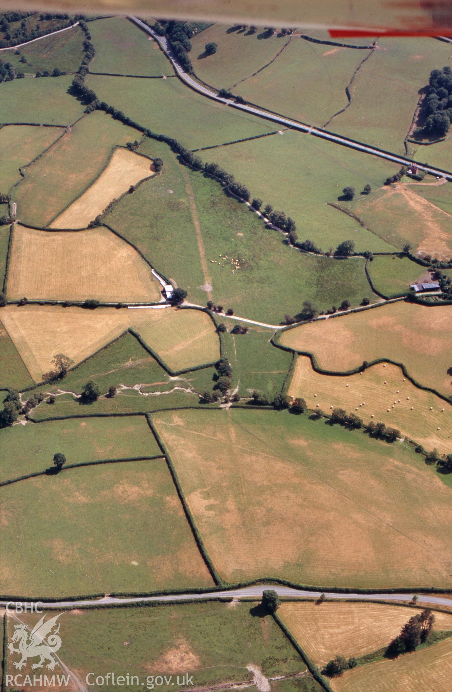 RCAHMW colour slide oblique aerial photograph of possible Roman road segment at Ty Lettice, Nantmel, taken by C.R.Musson on the 27/07/1996