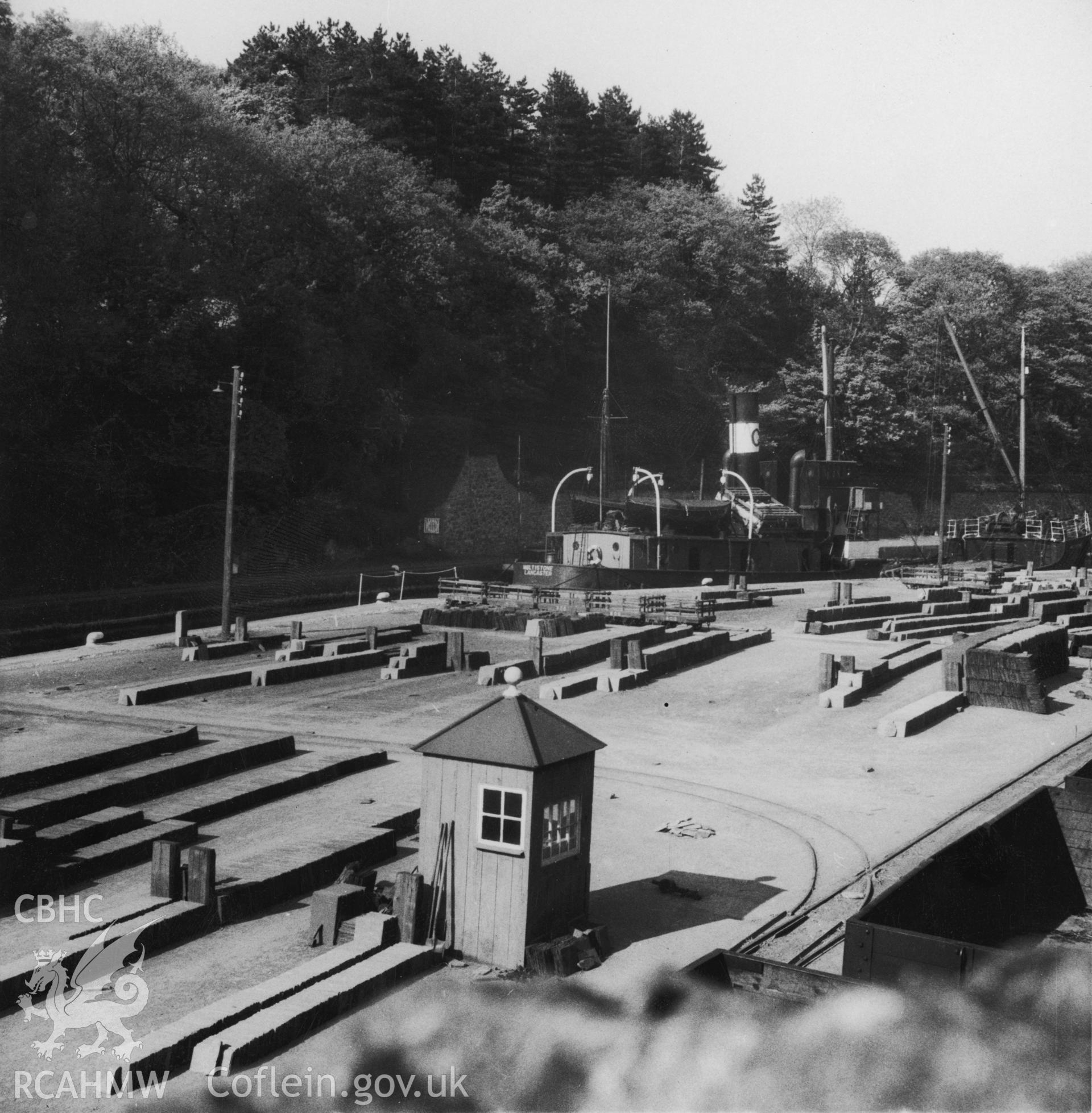 Port Dinorwic Harbour; Two B&W photos of the harbour showing the terminus of the railway from Dinorwic slate quarry and the slate stacks on the quayside., taken by Beaver, dated May 1946. Negatives not held.