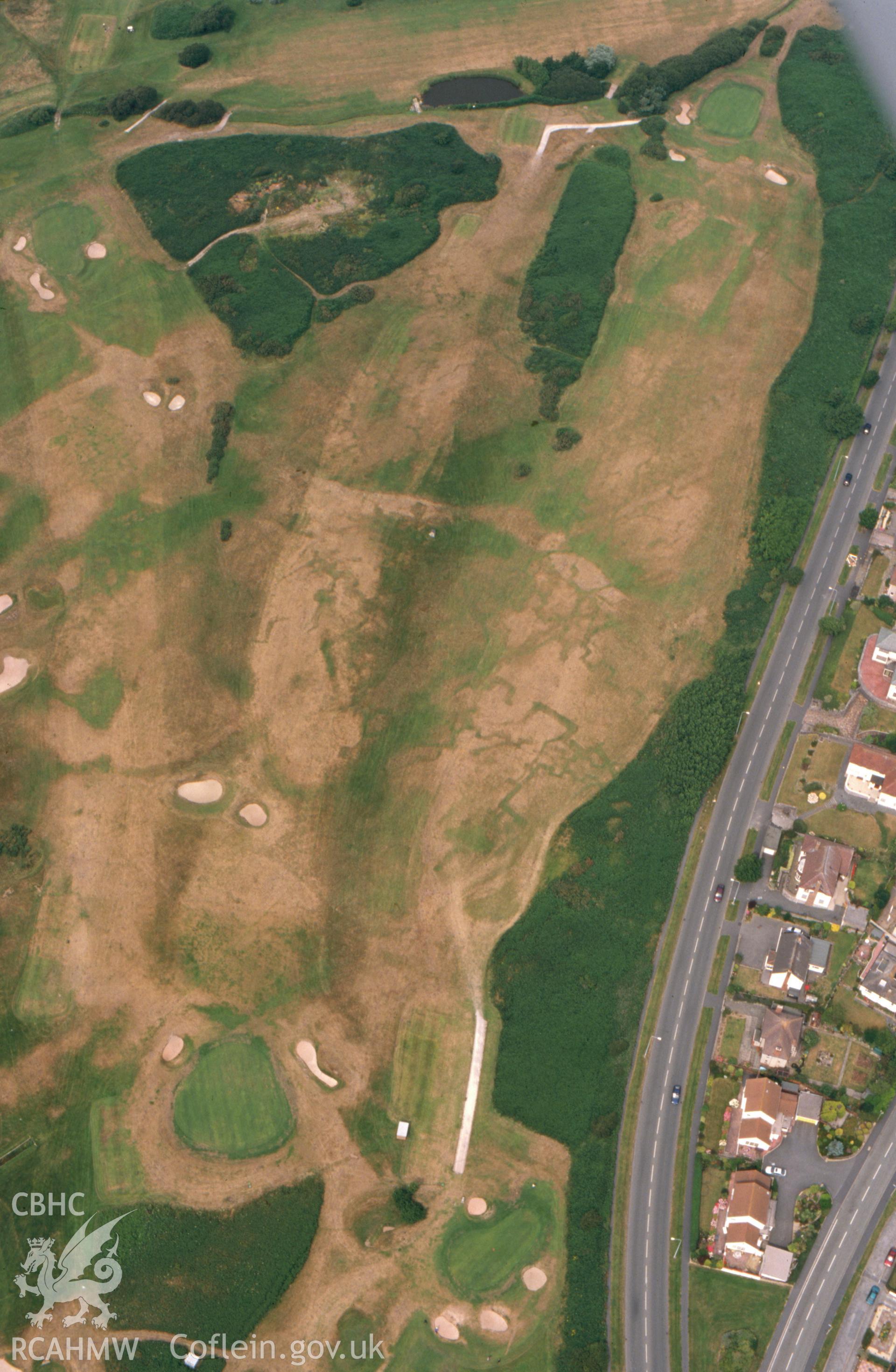 RCAHMW colour slide aerial photograph of Maesdu Golf Course, First World War practice trenches, parchmarks. Taken by Toby Driver on 15/07/2003