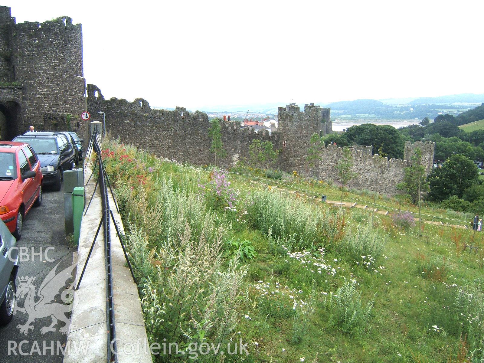 Gate and wall to the south-east extending two towers to the south corner of the circuit.