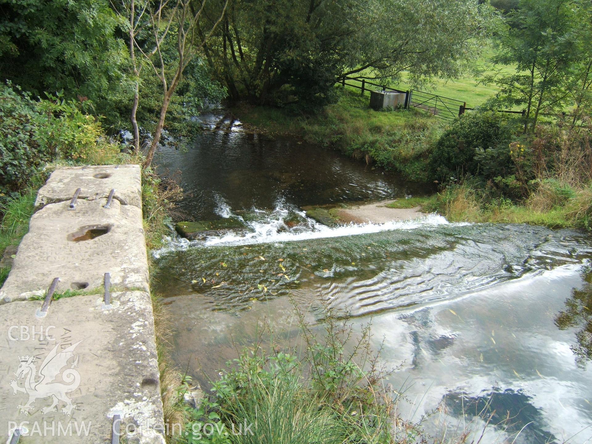 NE weir coping with wrought-iron straps looking SE.