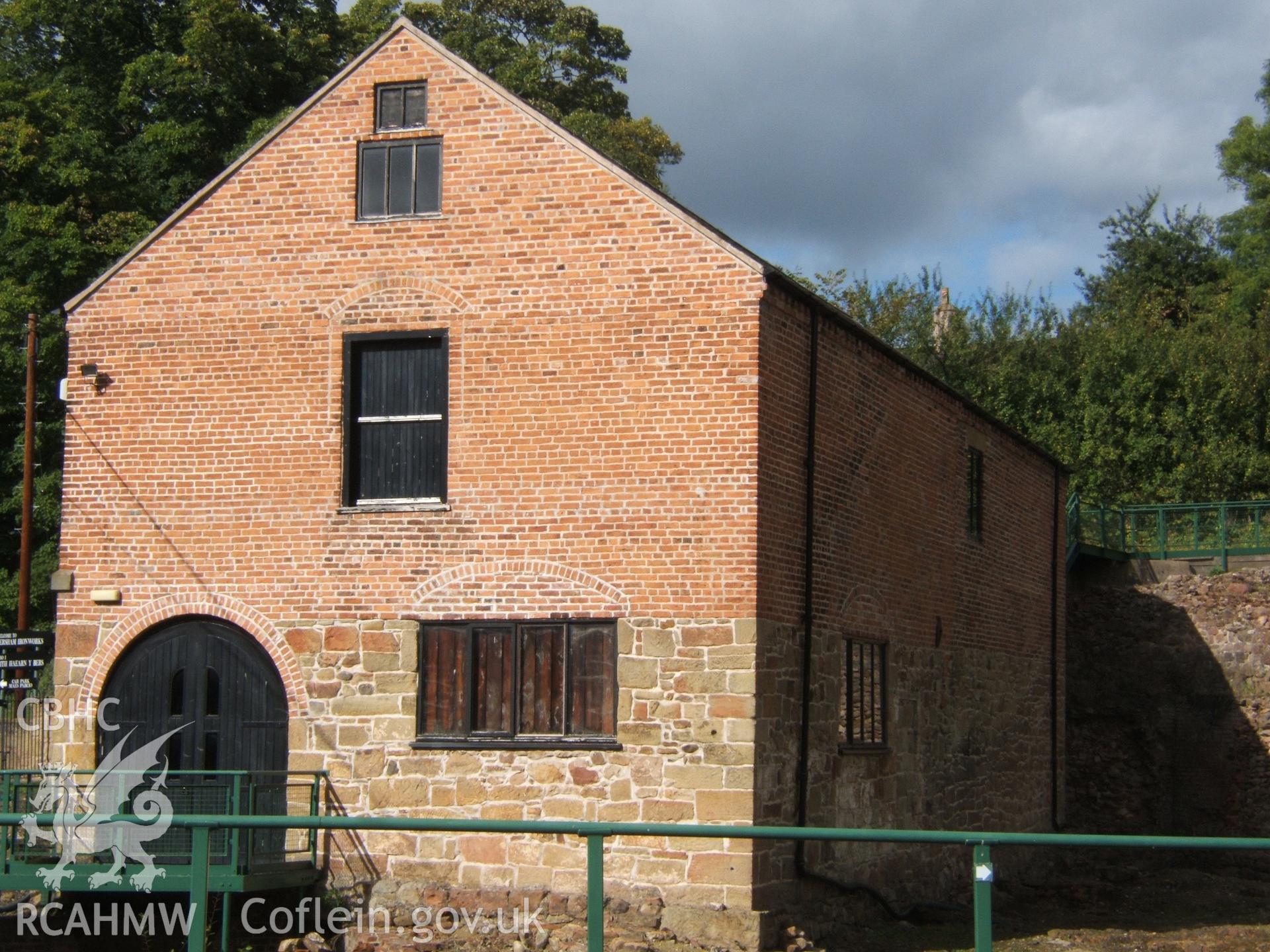 Mill, original wall of boring mill to right (E), from SE.