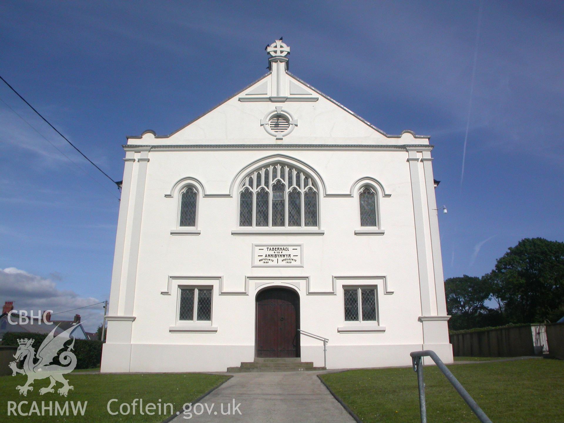 NW front showing large Perpendicular window flanked by lancets.