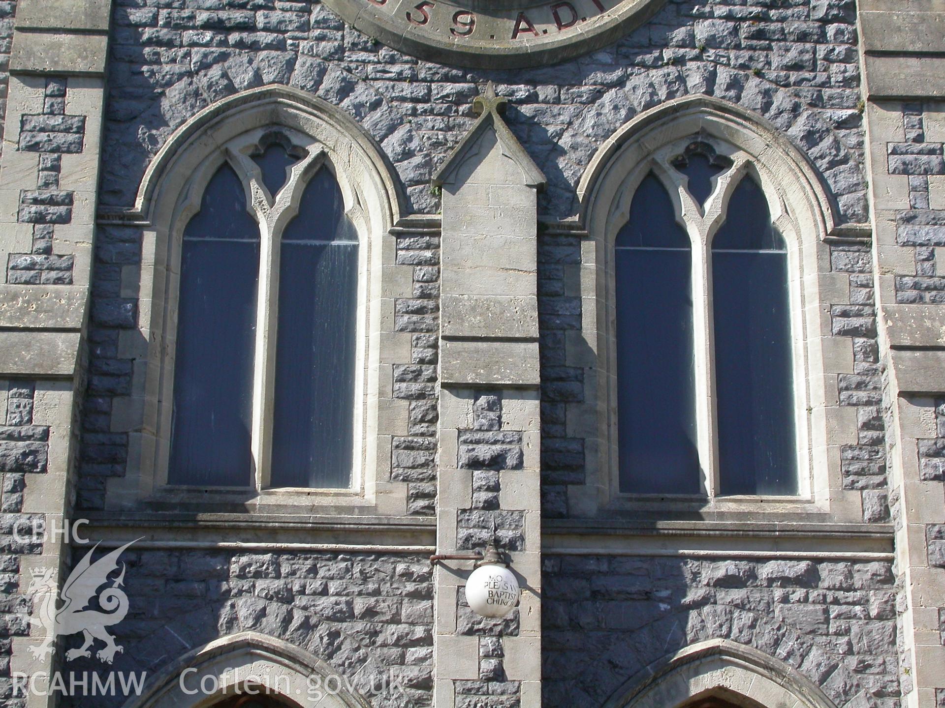 Twin 'Y' tracery windows over the twin doors on the SW front.