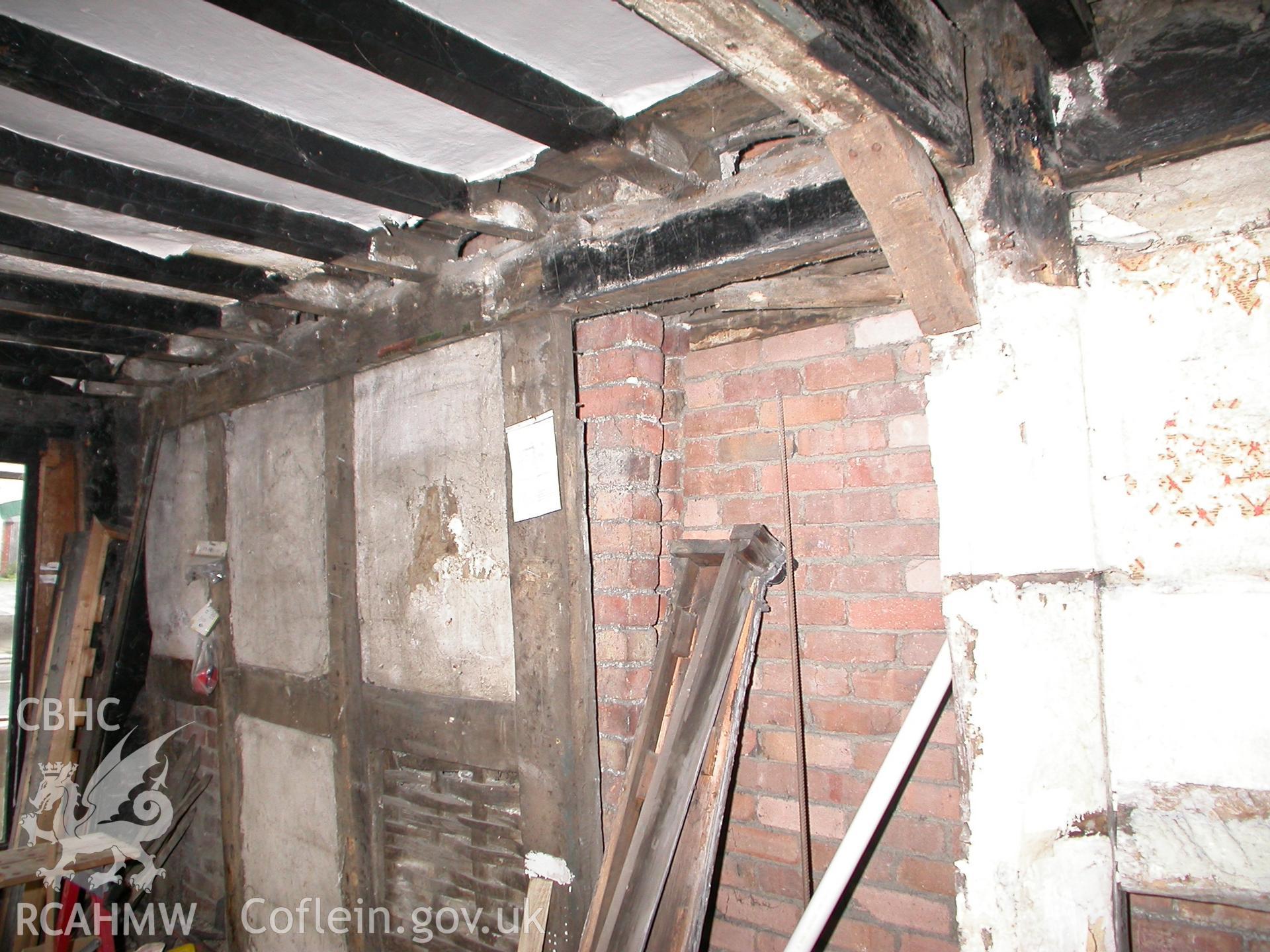 Interior of E wall showing doorway opening & adjacent brick building.