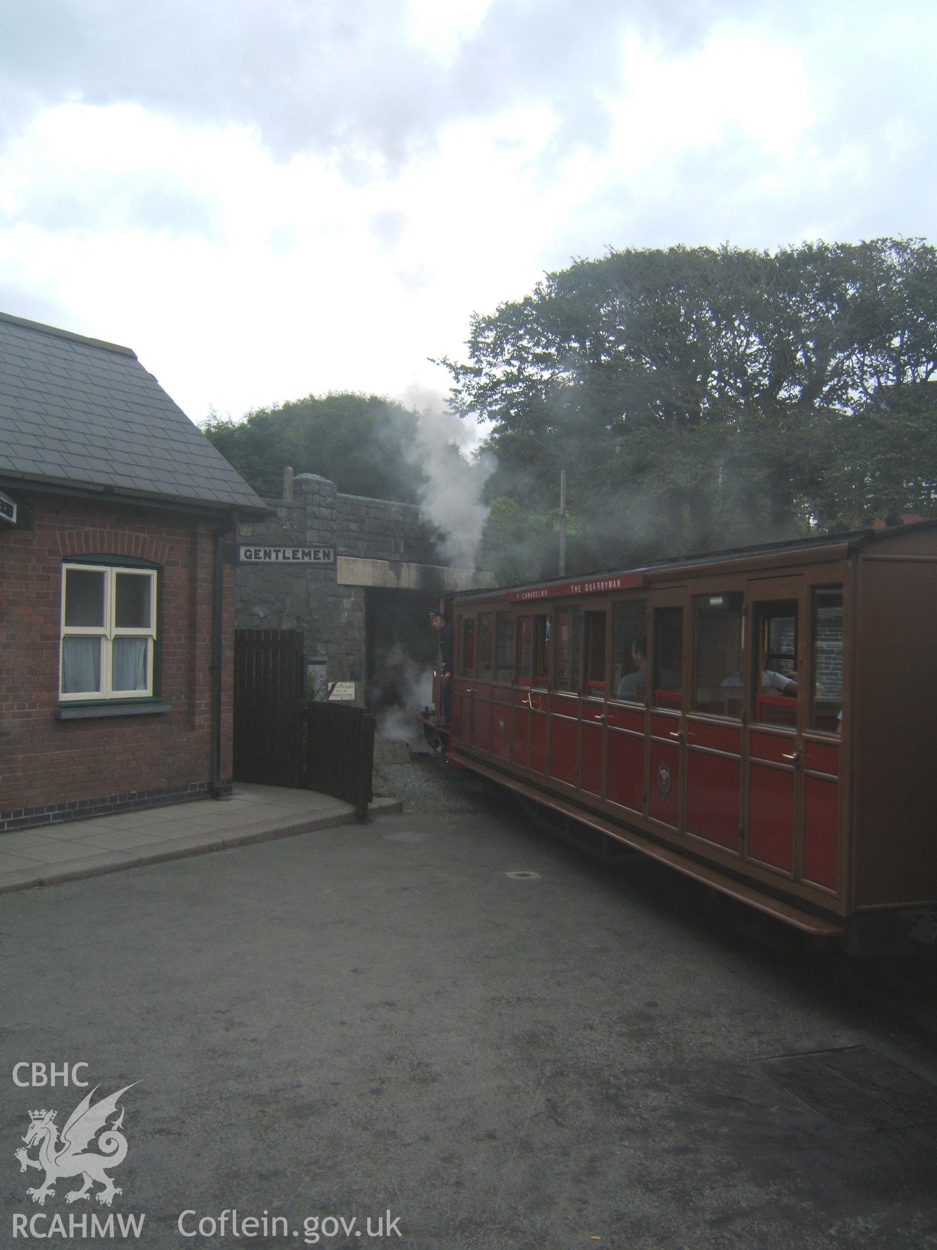 'Douglas? leading train out under bridge at NE of station.