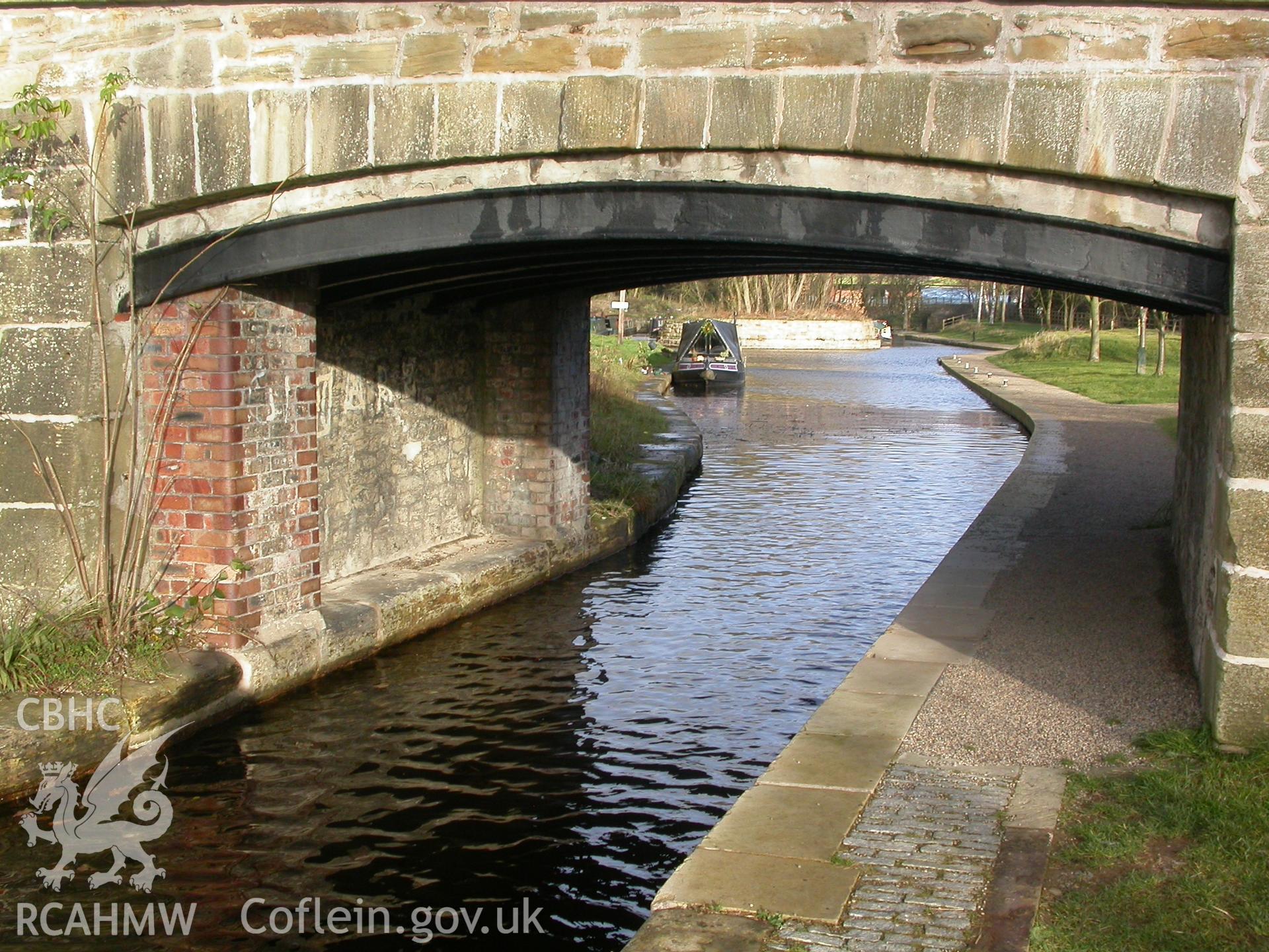 Detail of iron ribs supporting flat-stone arch, south-west front.