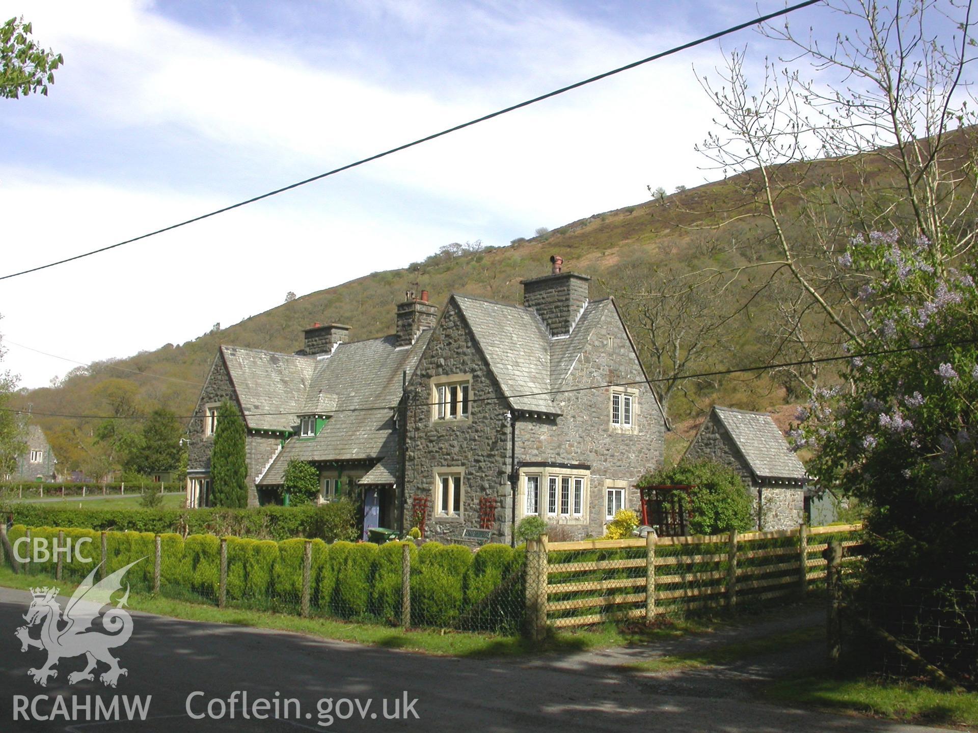 Semi-detached house from the main village street to the north-west, in landscape.