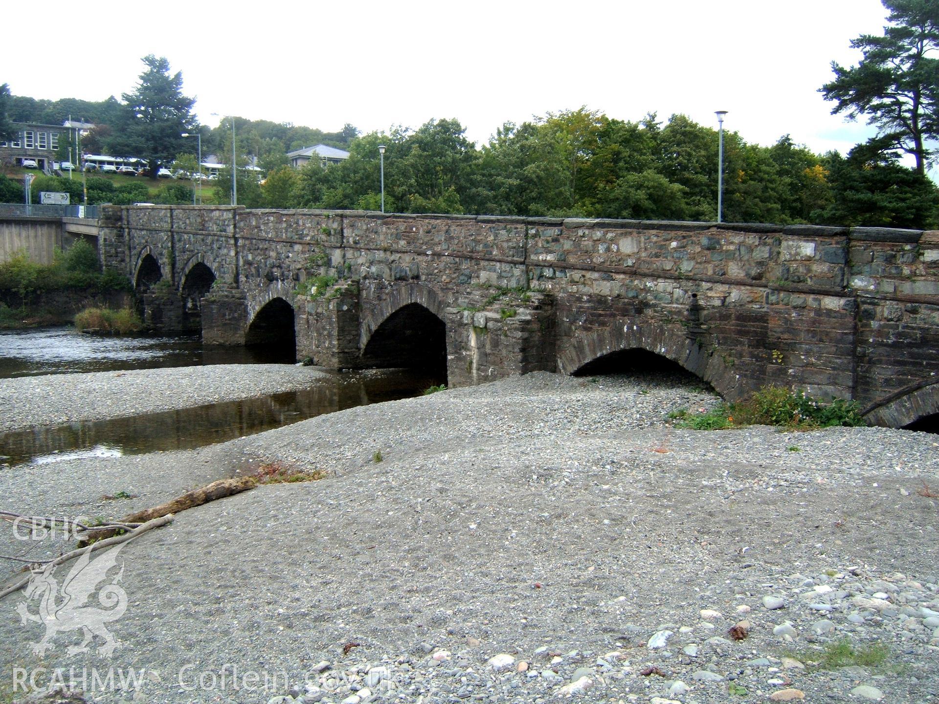 View from the SW showing four earlier arches nearer camera.