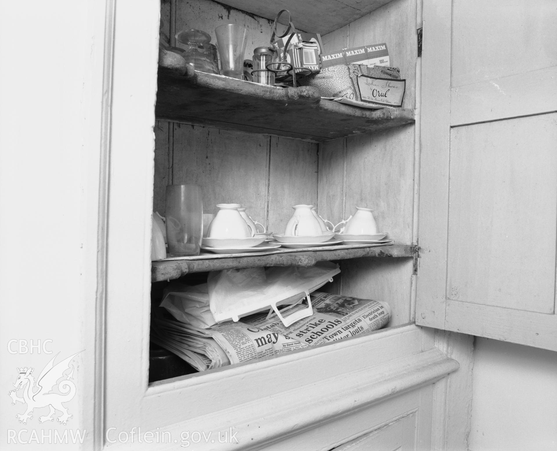 Interior view showing built-in cupboard.