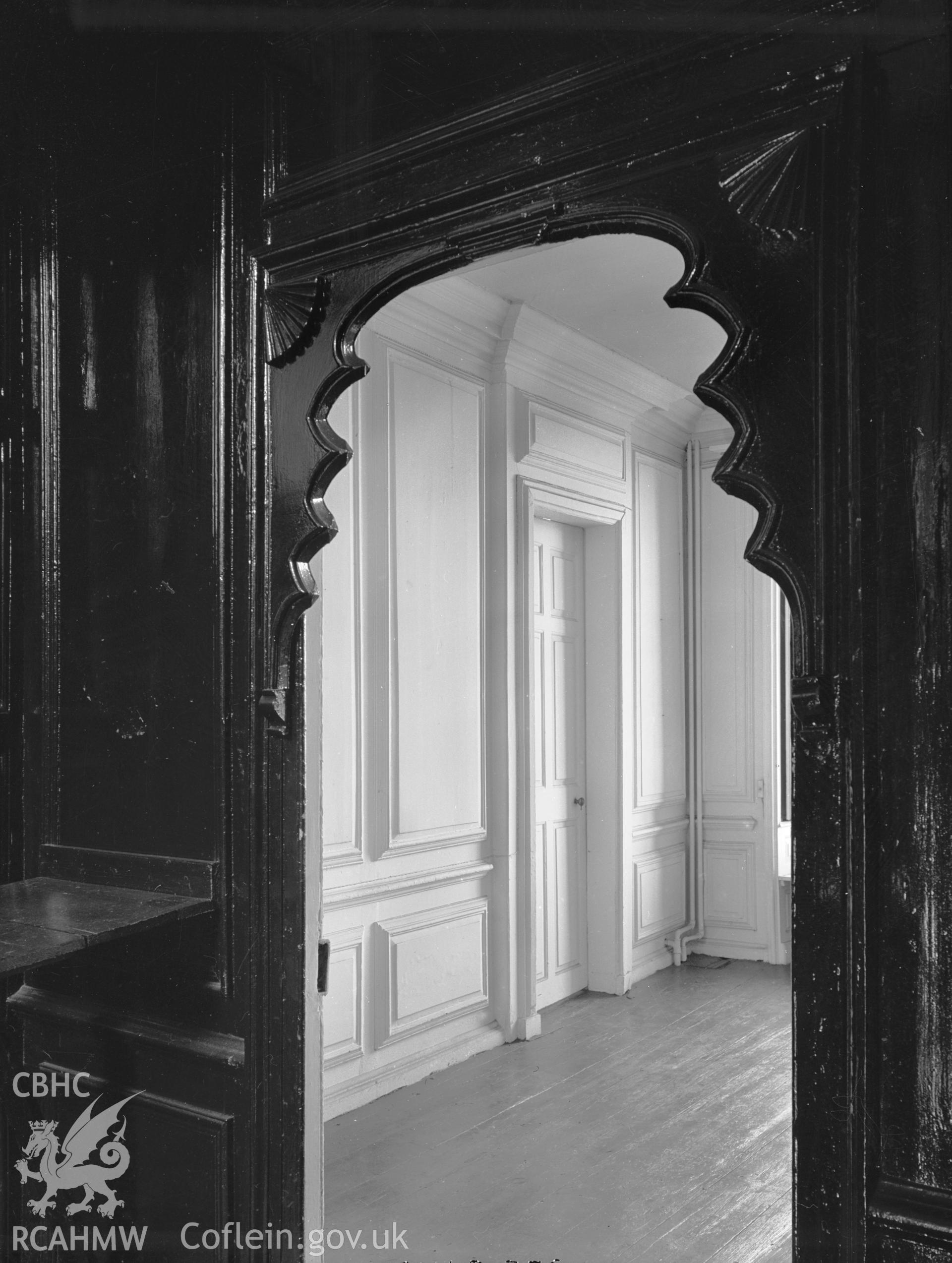 Interior view showing doorway to the panelled room on the first floor of Rhyd y Gors House.