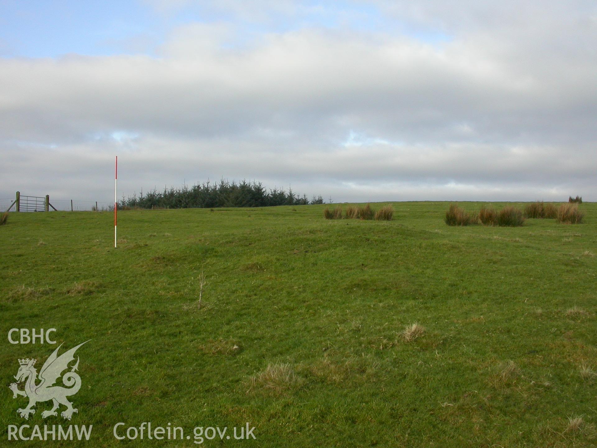 Northernmost of two round barrows within complex, view from east: scale 0.5m sections (NPRN403515)