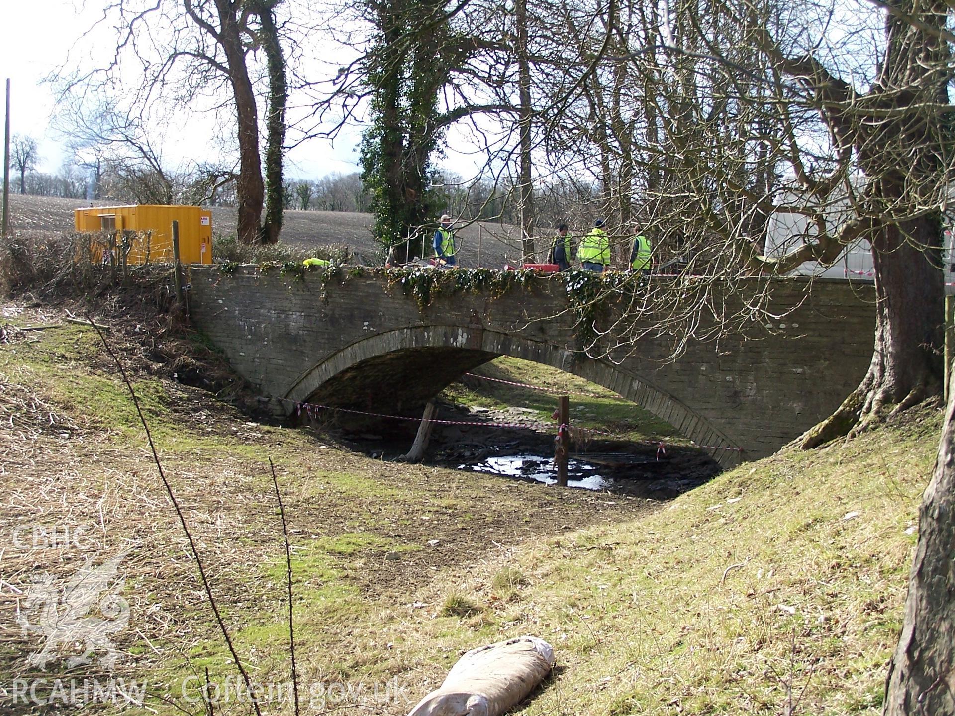 Castle Malgwyn Bridge 1 (east face) and the earthwork remains of the canal which fed the Castell Malgwyn Tinplate Works.