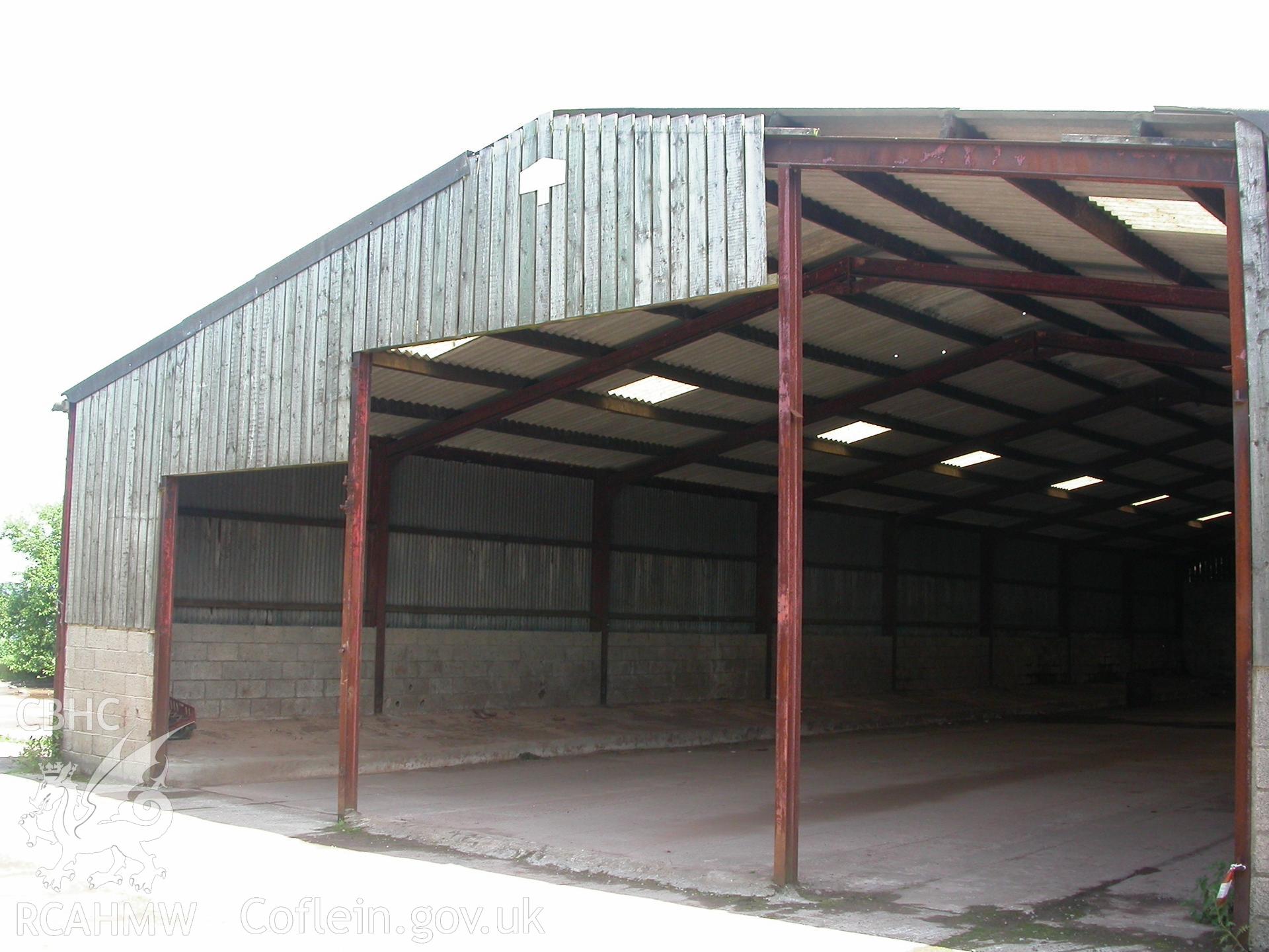 Exterior, west end of Late-C20th, 8-bay, iron girder/corrugated roof, cattle house.