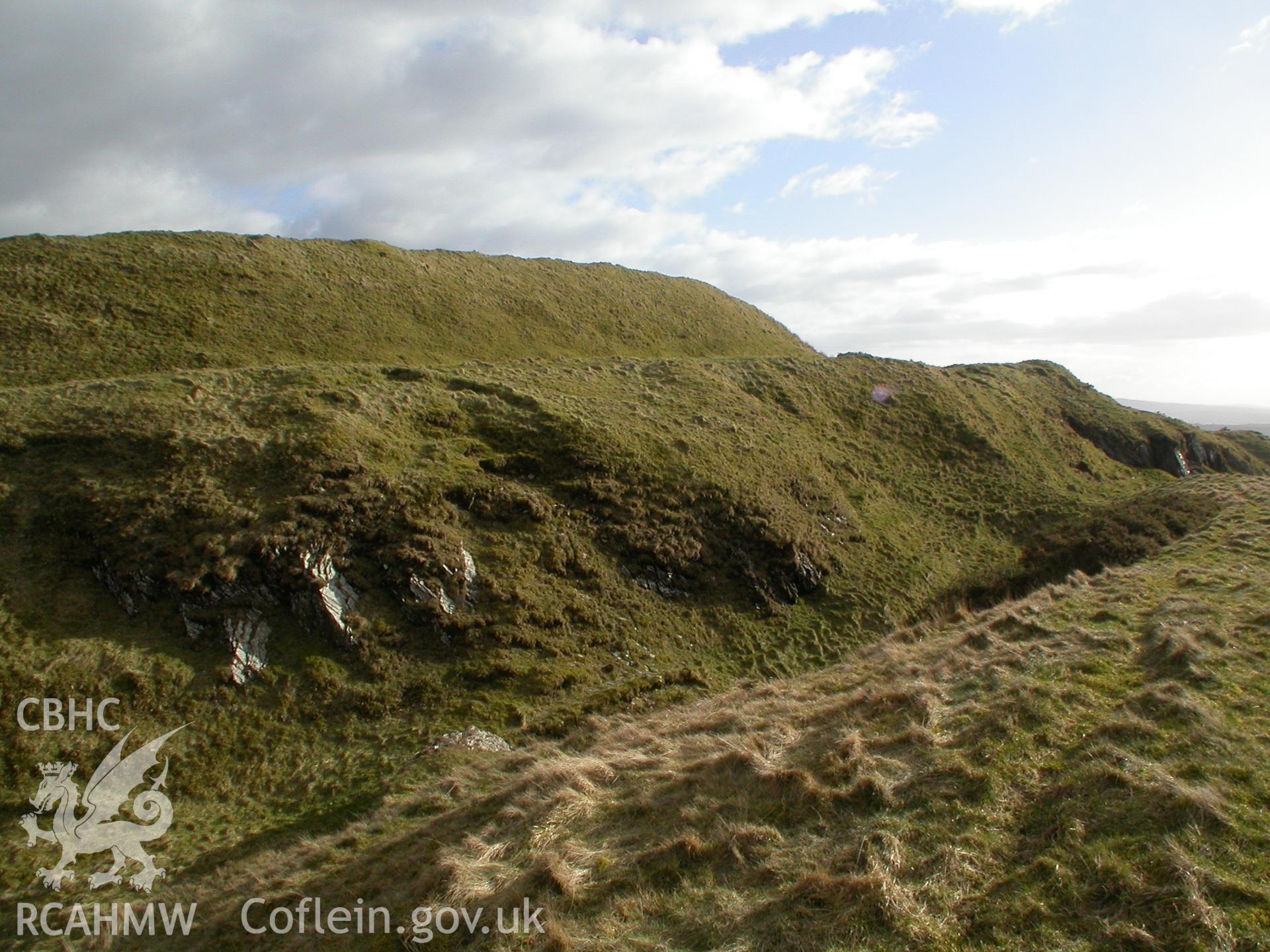 Darren Mine: East face of open cut adjacent to hillfort, incorporating an outwork of the fort.