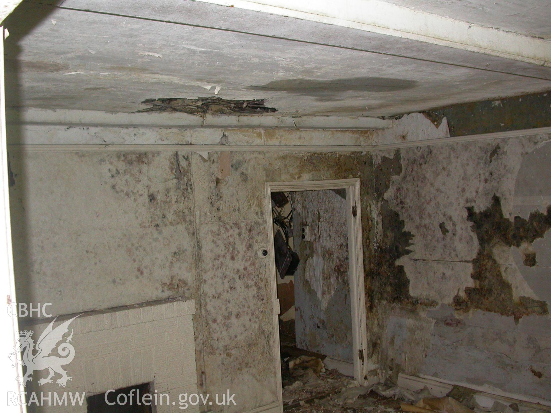 Parlour fireplace and doorway to hall.