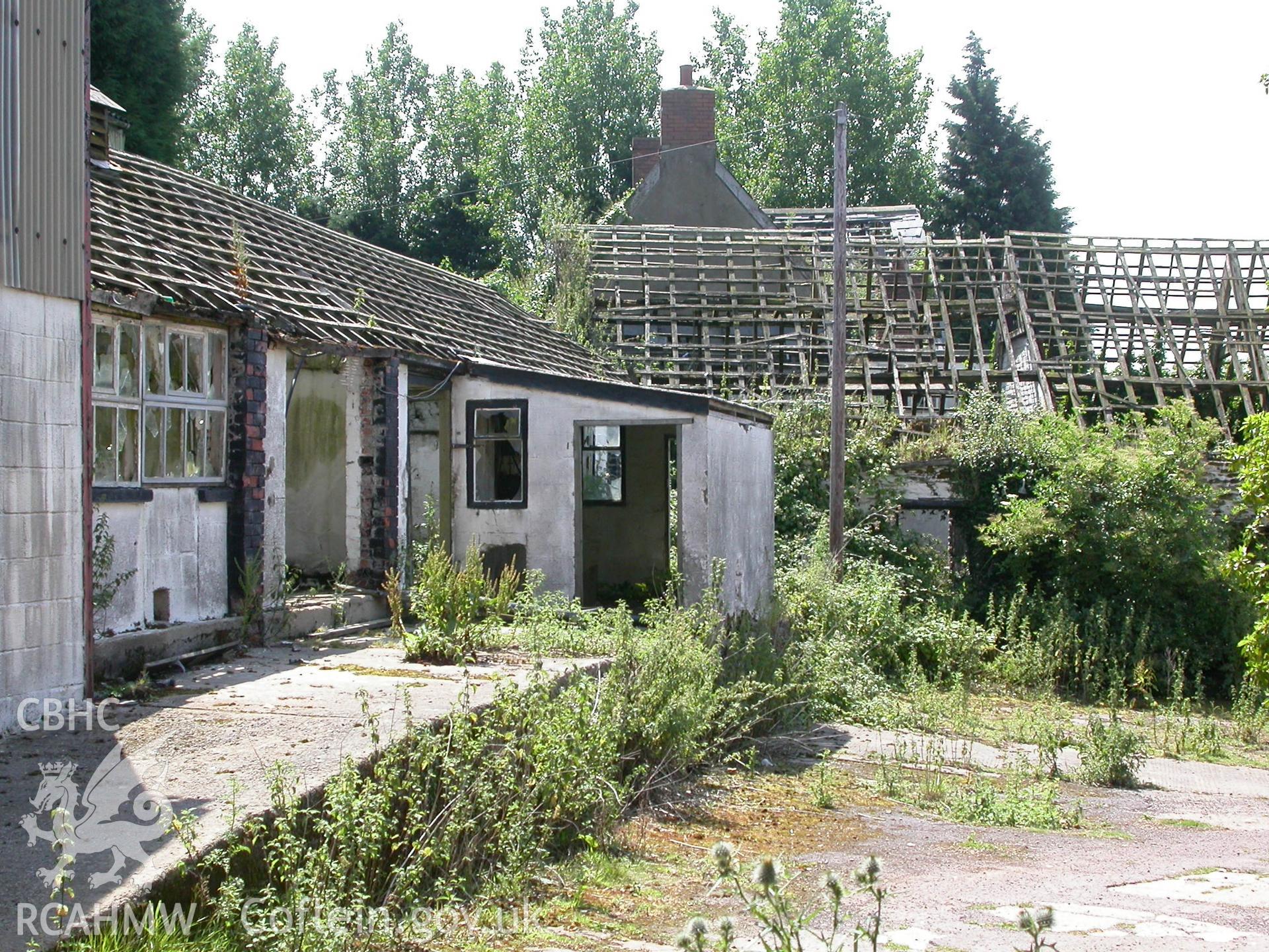 Late C19th cow-house, west elevation and combination range beyond.