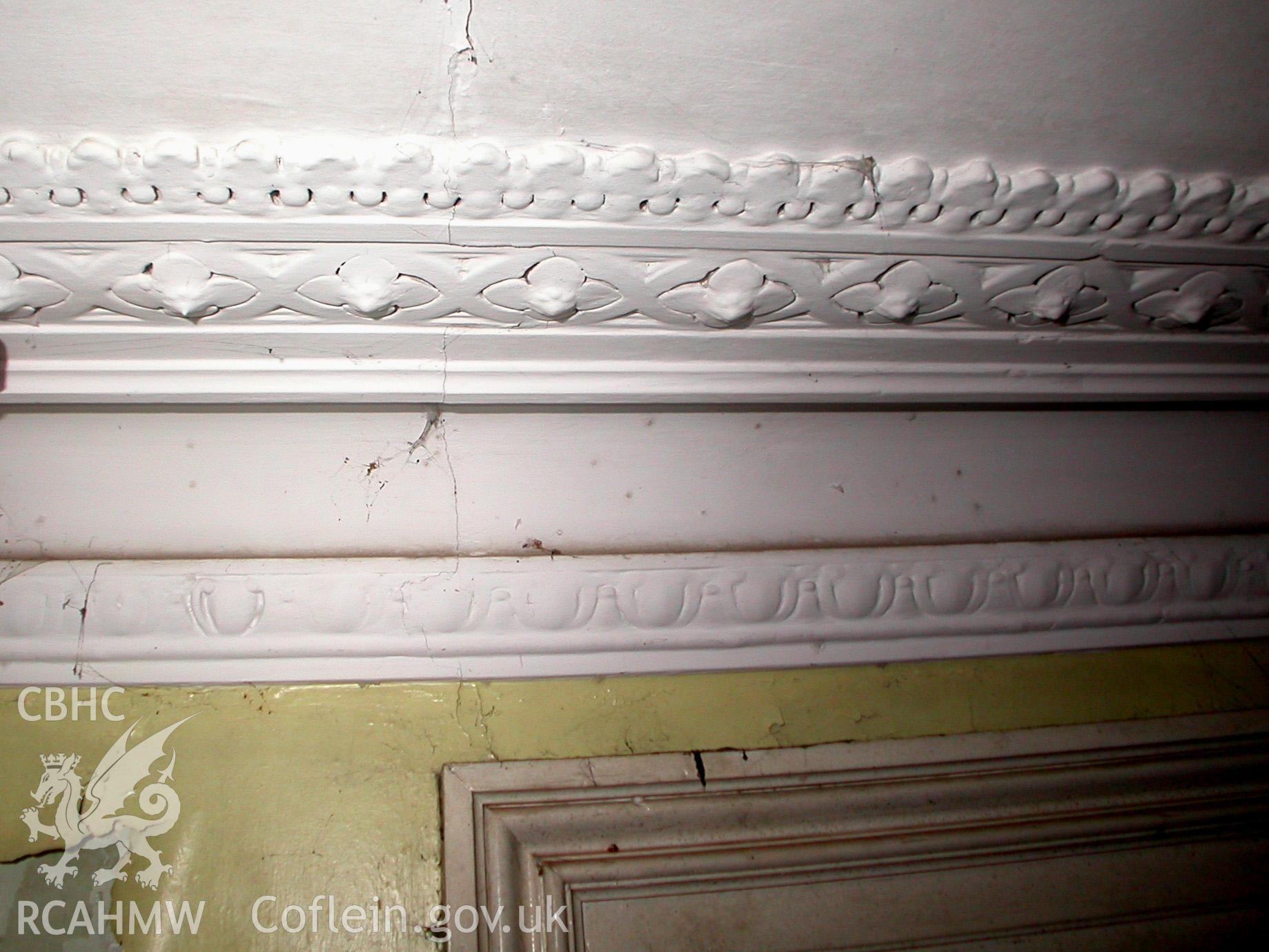 Ground floor, front right reception room, detail of cornicing on side wall.