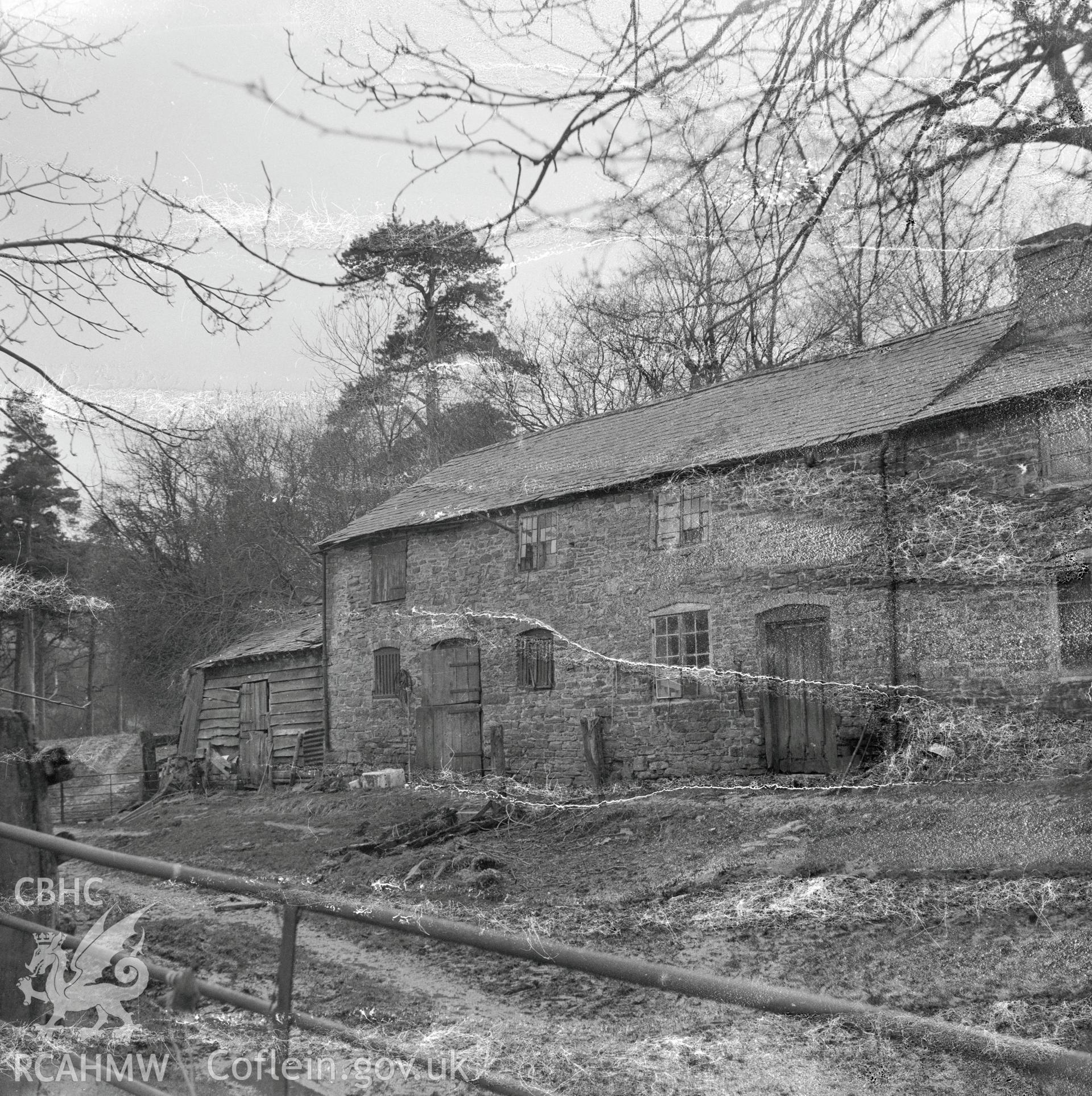 View of east facing side of the house and barn, demolished in 2000.