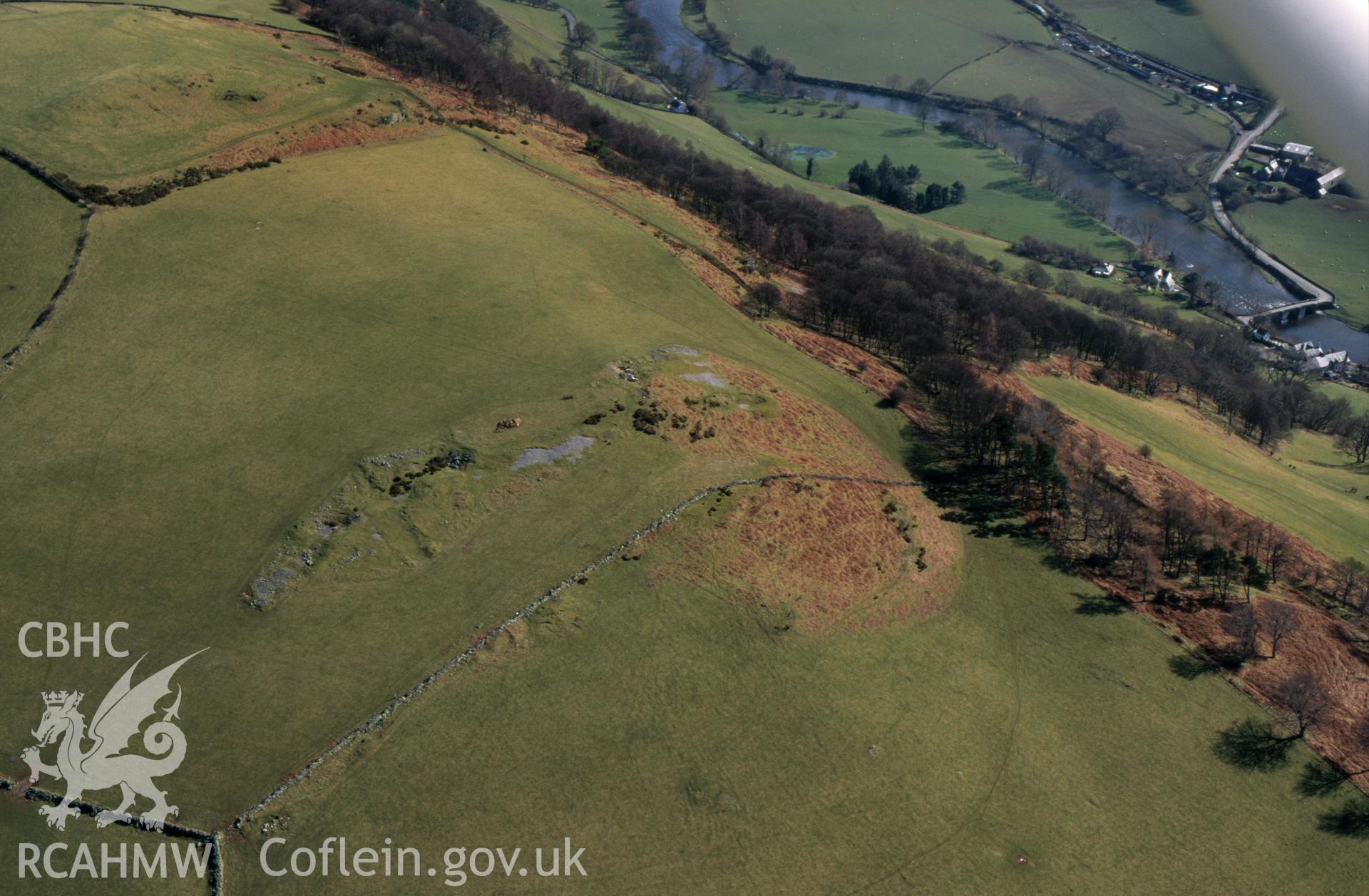 RCAHMW colour oblique aerial photograph of Carrog Bridge, Earthwork and landscape. Taken by C R Musson on 13/03/1995