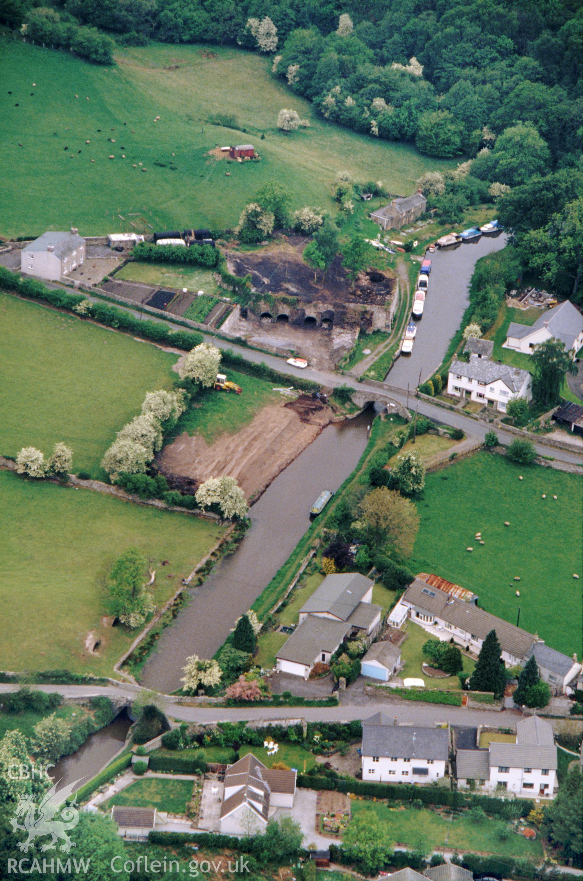 Slide of RCAHMW colour oblique aerial photograph of Canal Wharf Yard, Llangattock, taken by C.R. Musson, 11/5/1990.