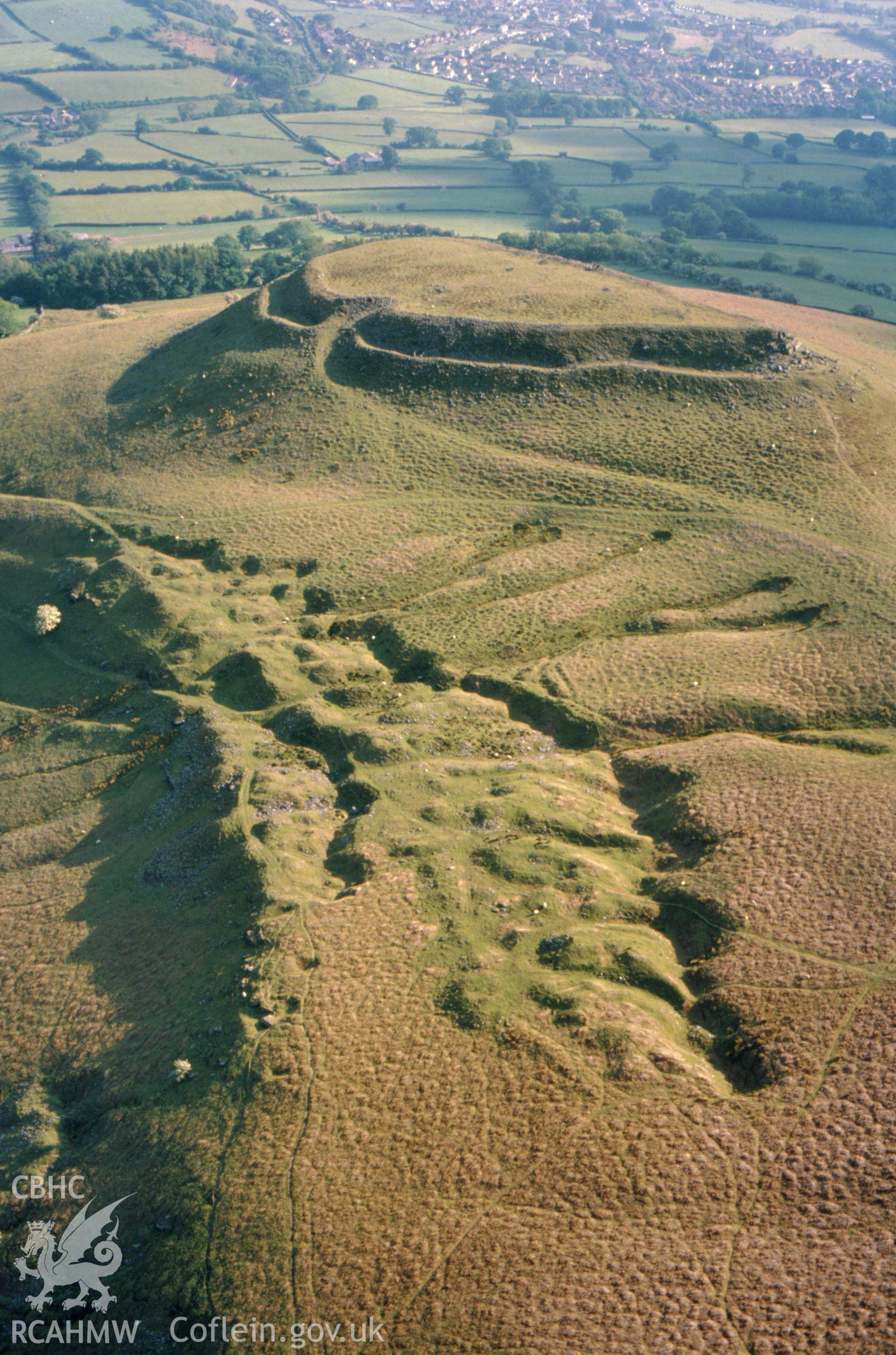 Slide of RCAHMW colour oblique aerial photograph of Crug Hywel Camp, taken by C.R. Musson, 24/5/1990.