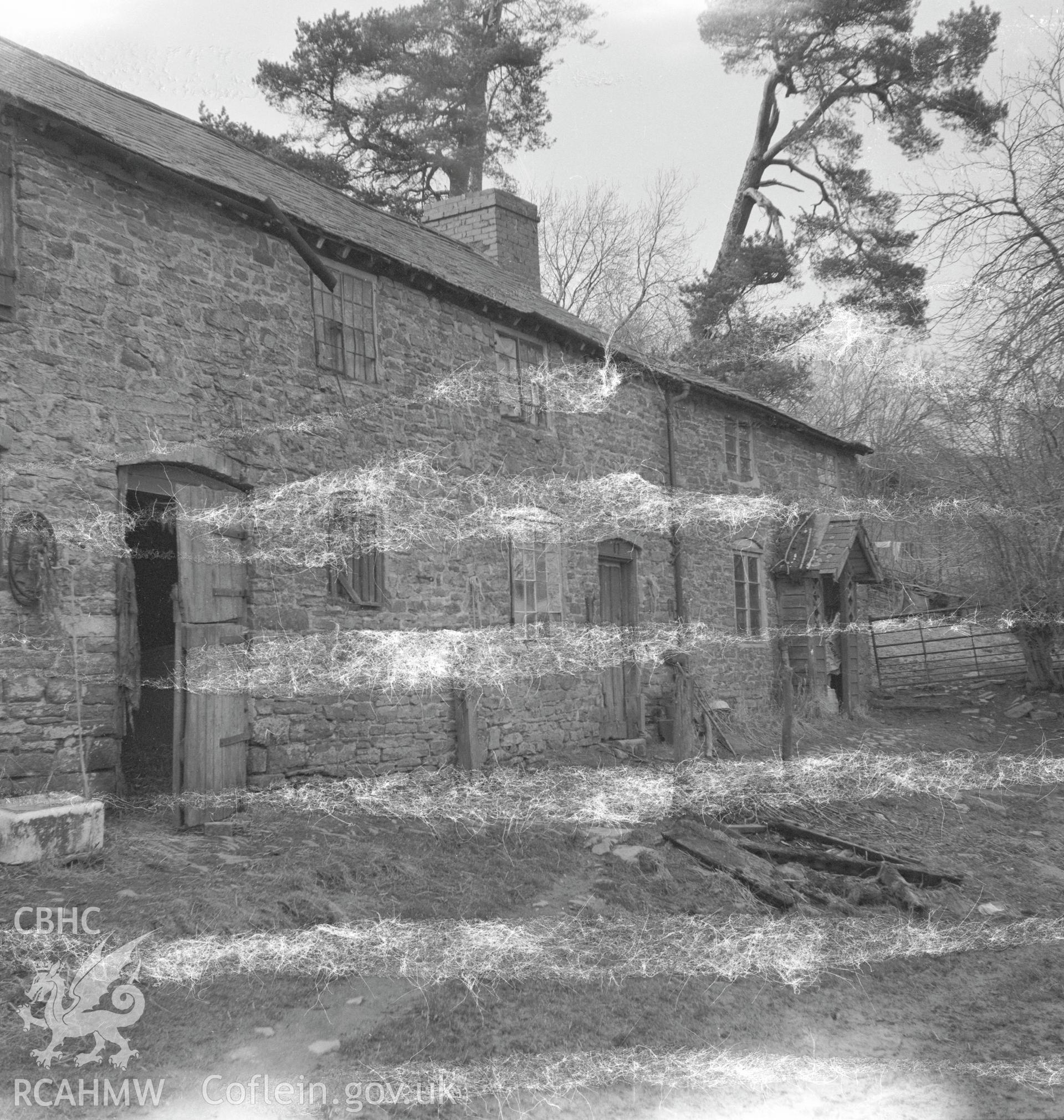 View of east facing side of the house and barn, demolished in 2000.