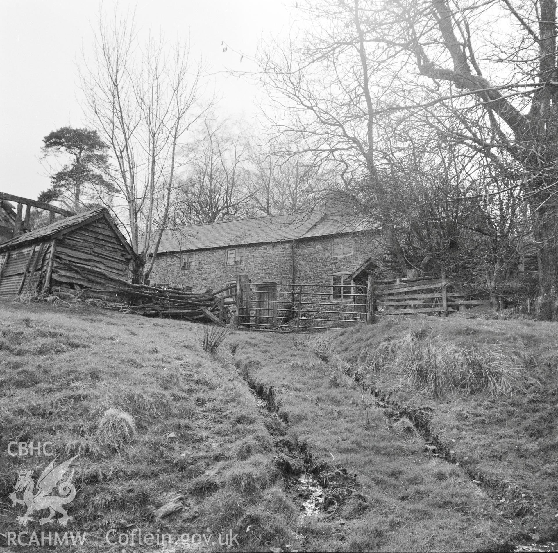 View of east facing side of the house and barn, demolished in 2000.