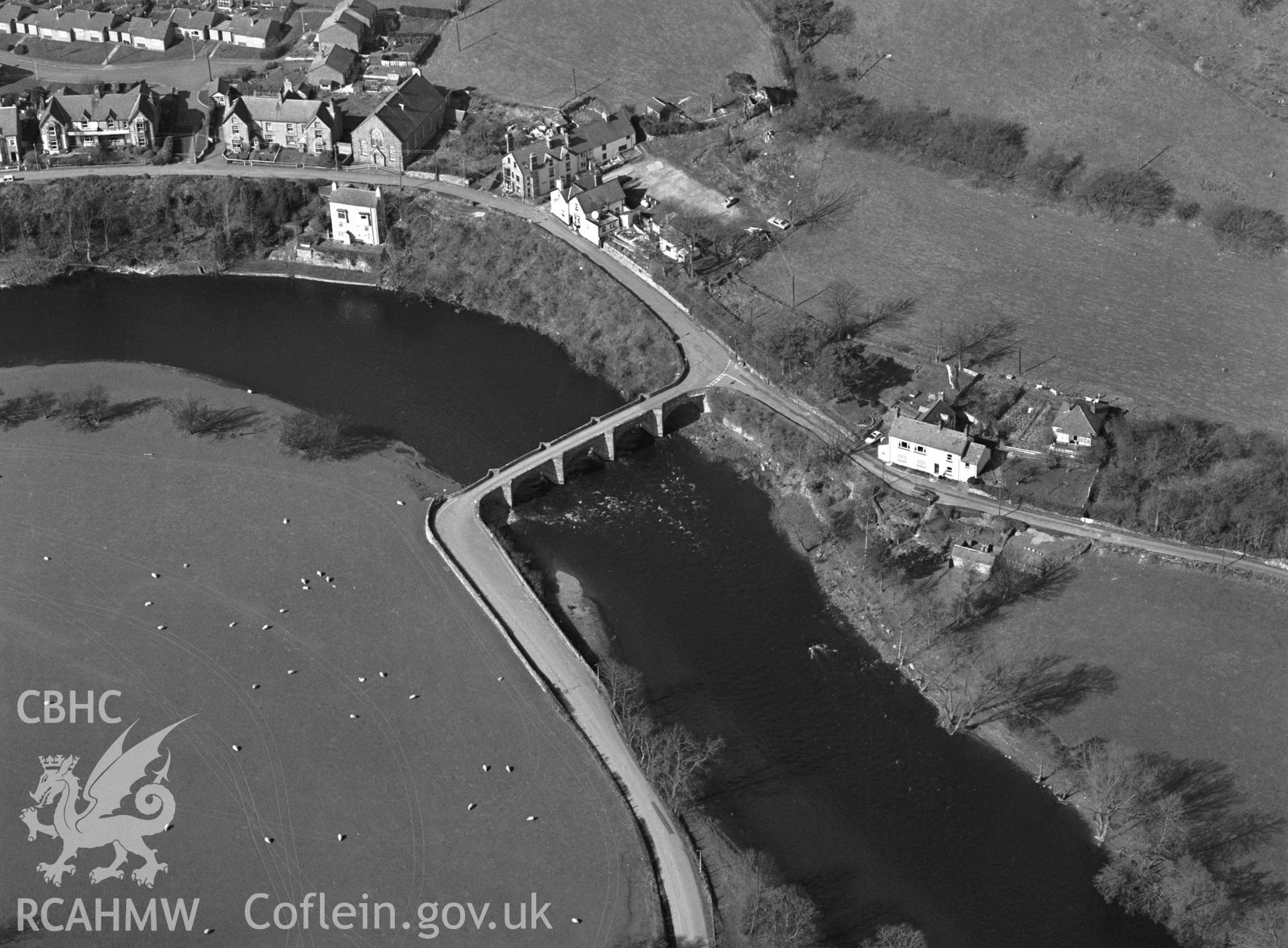 RCAHMW black and white oblique aerial photograph of Carrog Bridge, Earthwork and landscape. Taken by C R Musson on 13/03/1995