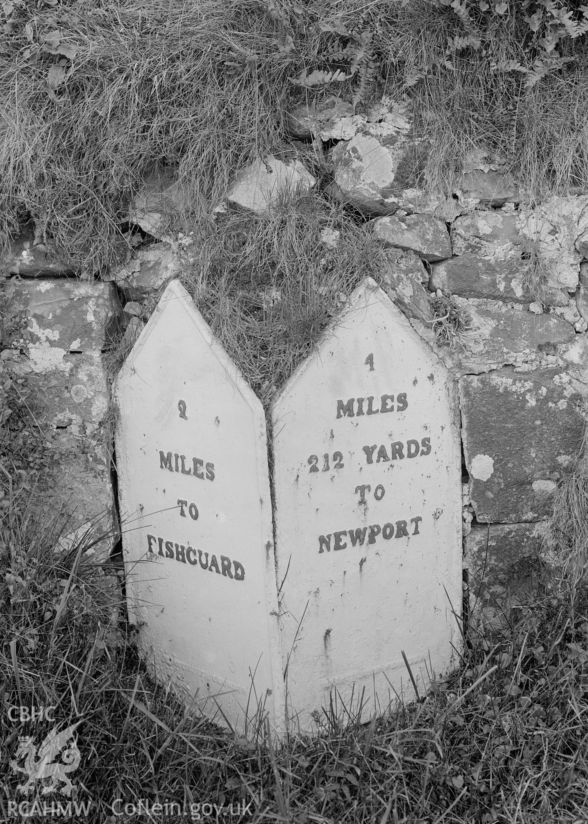 A black and white print of Dinas Cross Milestone.