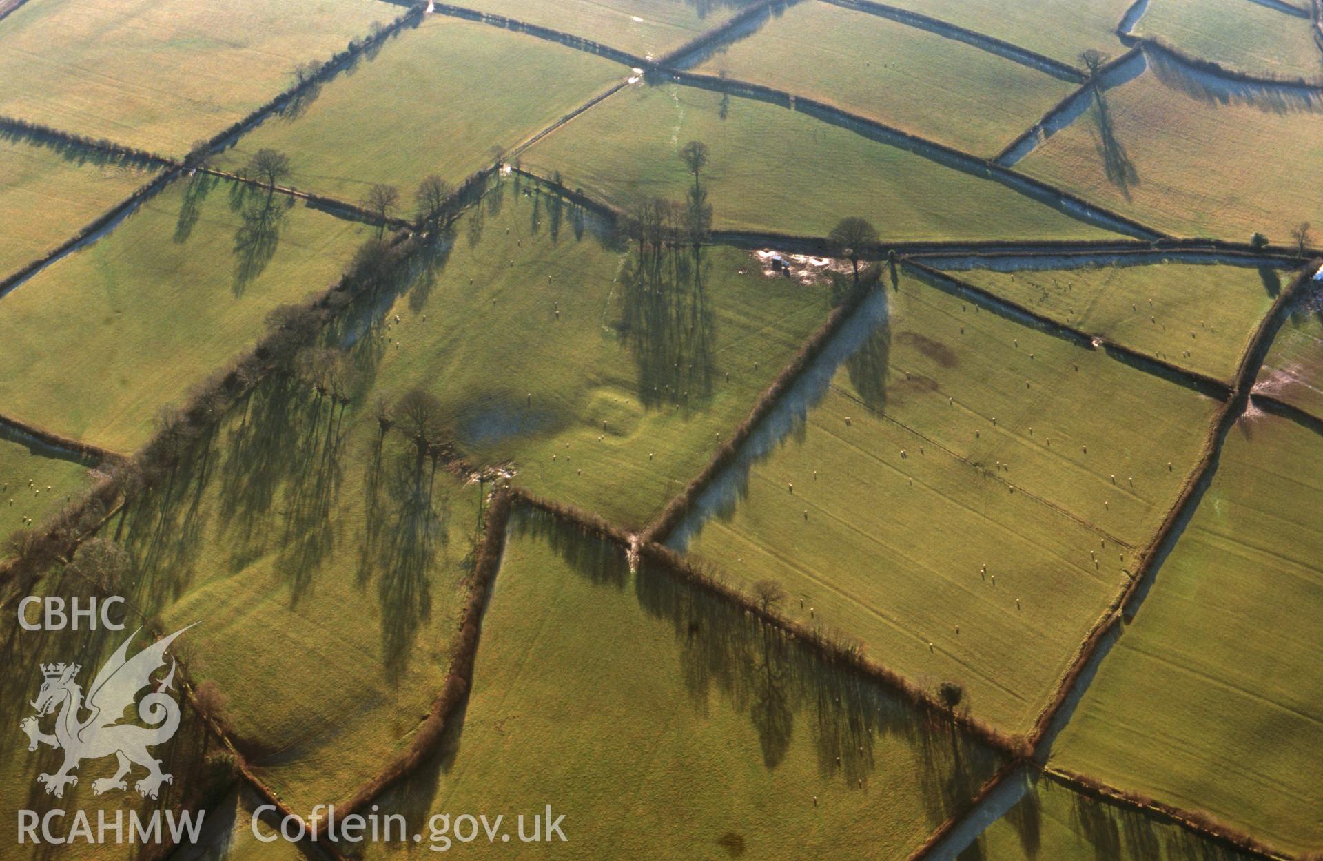 RCAHMW colour slide oblique aerial photograph of Alexanderstone Motte and Bailey, Llanddew, taken on 22/01/1999 by Toby Driver