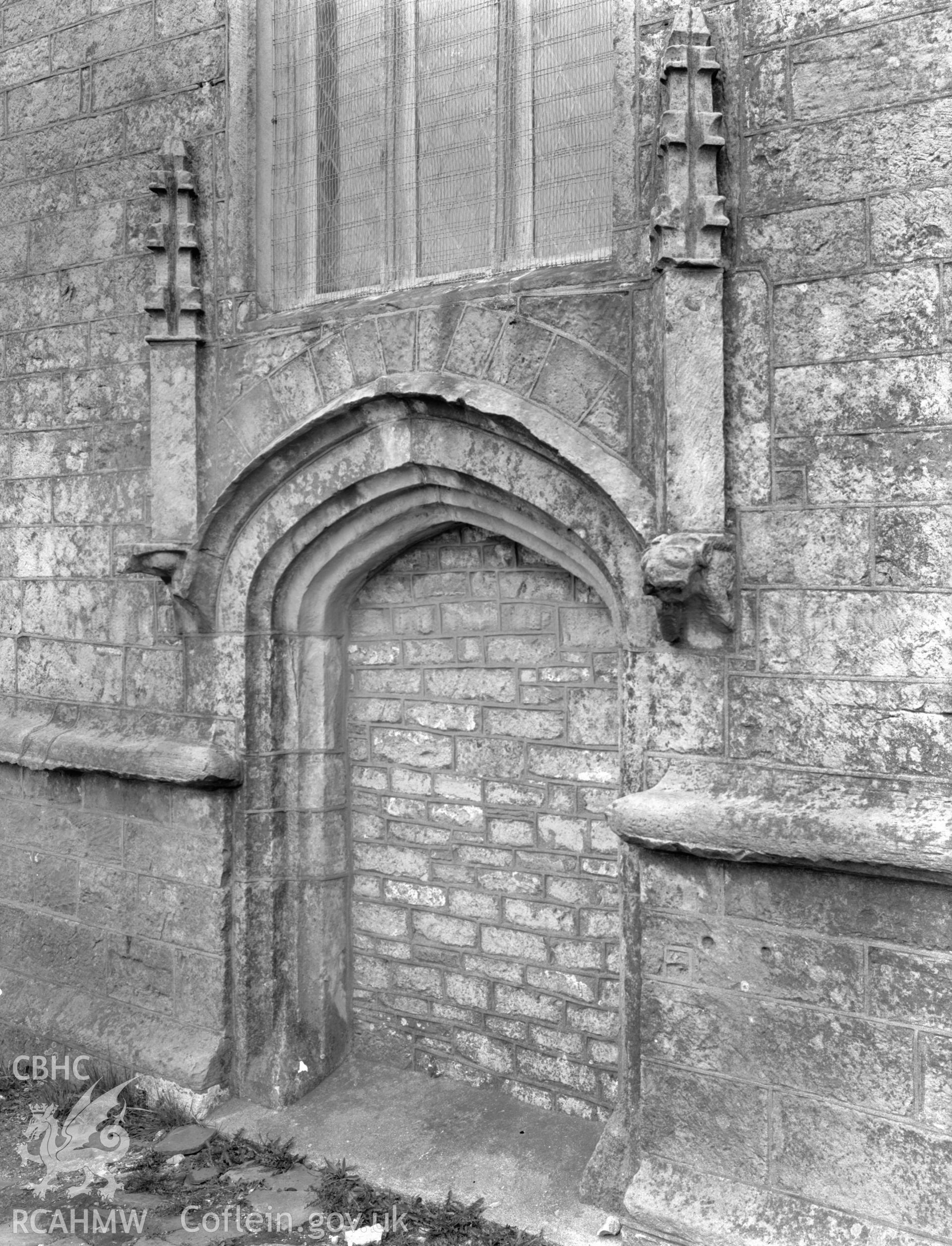 Exterior view of the blocked in west door at St David's Church, Laleston taken 09.04.65.