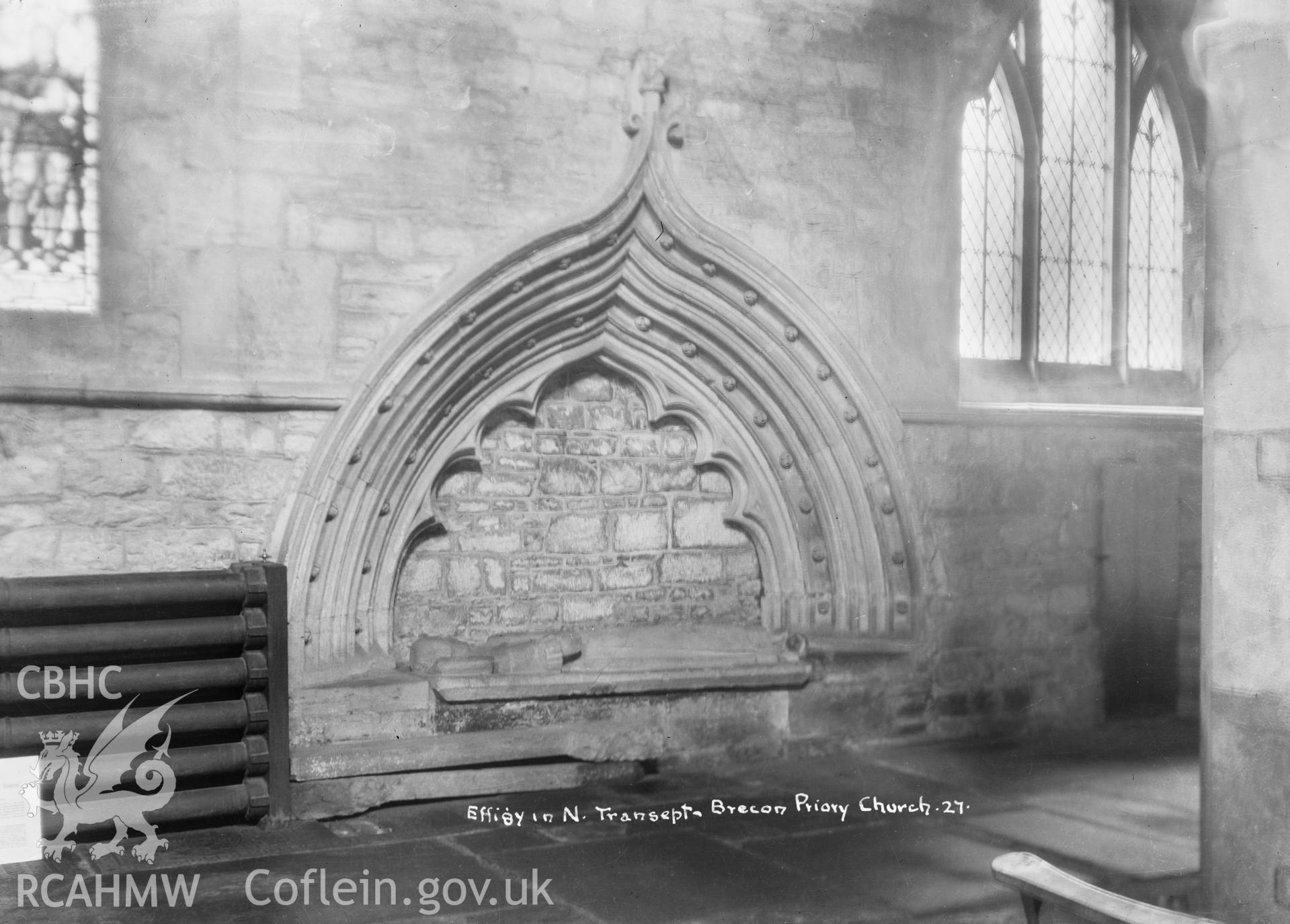 Interior view of Brecon Priory Church showing effigy in north transcept, taken by W A Call circa 1920.