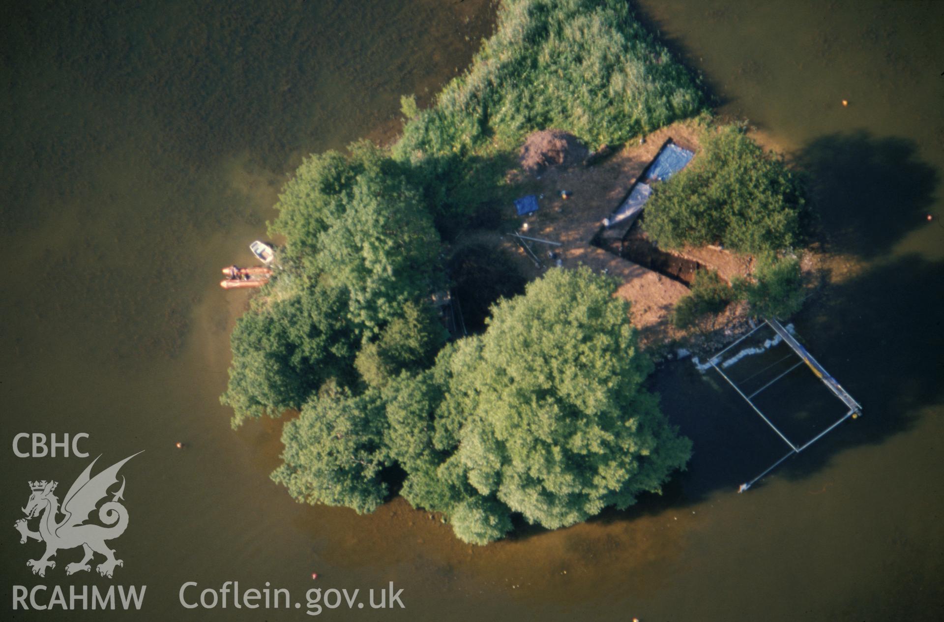 Slide of RCAHMW colour oblique aerial photograph of Llangorse Crannog, taken by C.R. Musson, 1989.