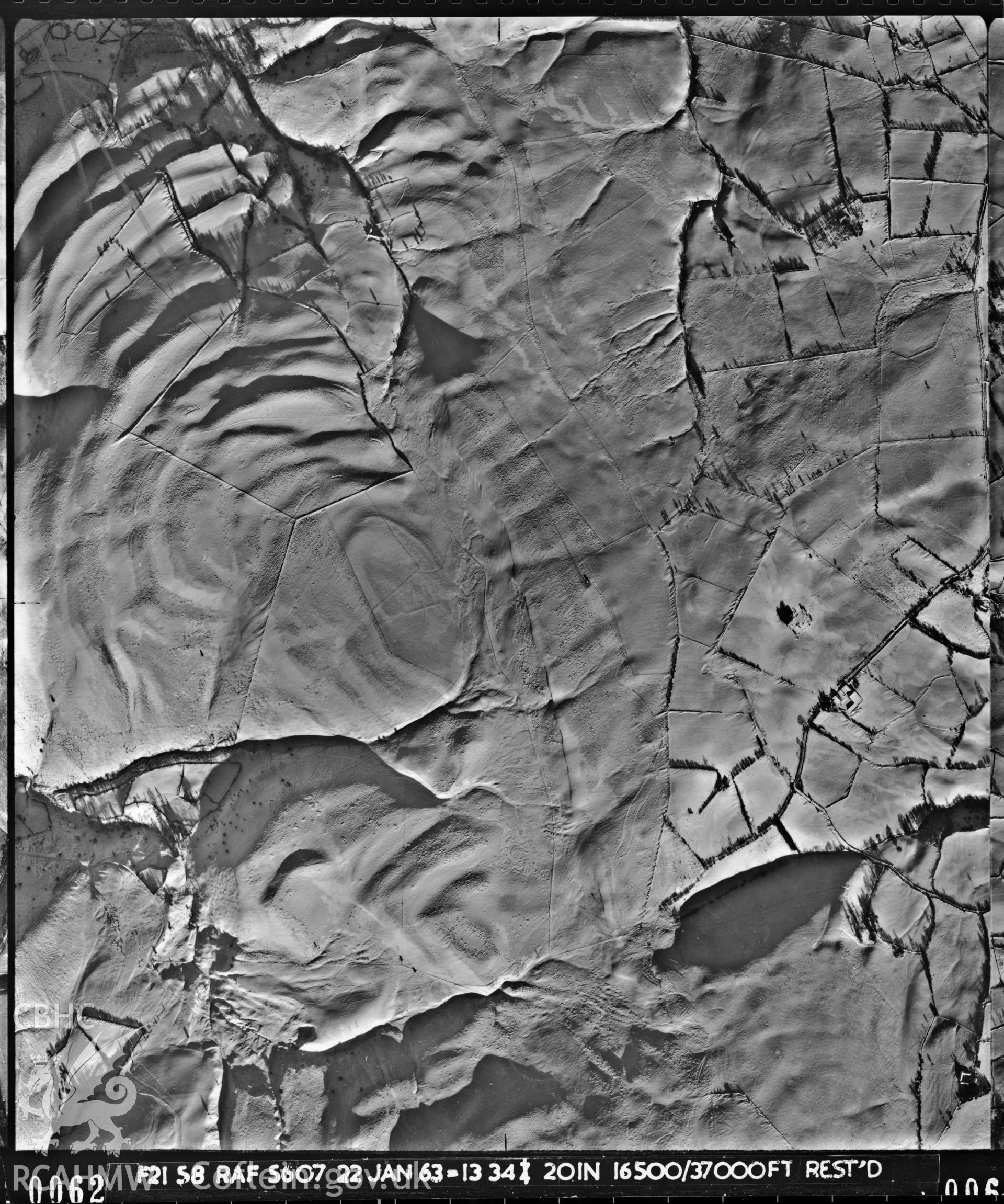 Black and white vertical aerial photograph taken by the RAF in 1963, centred on the area around Llanidloes..